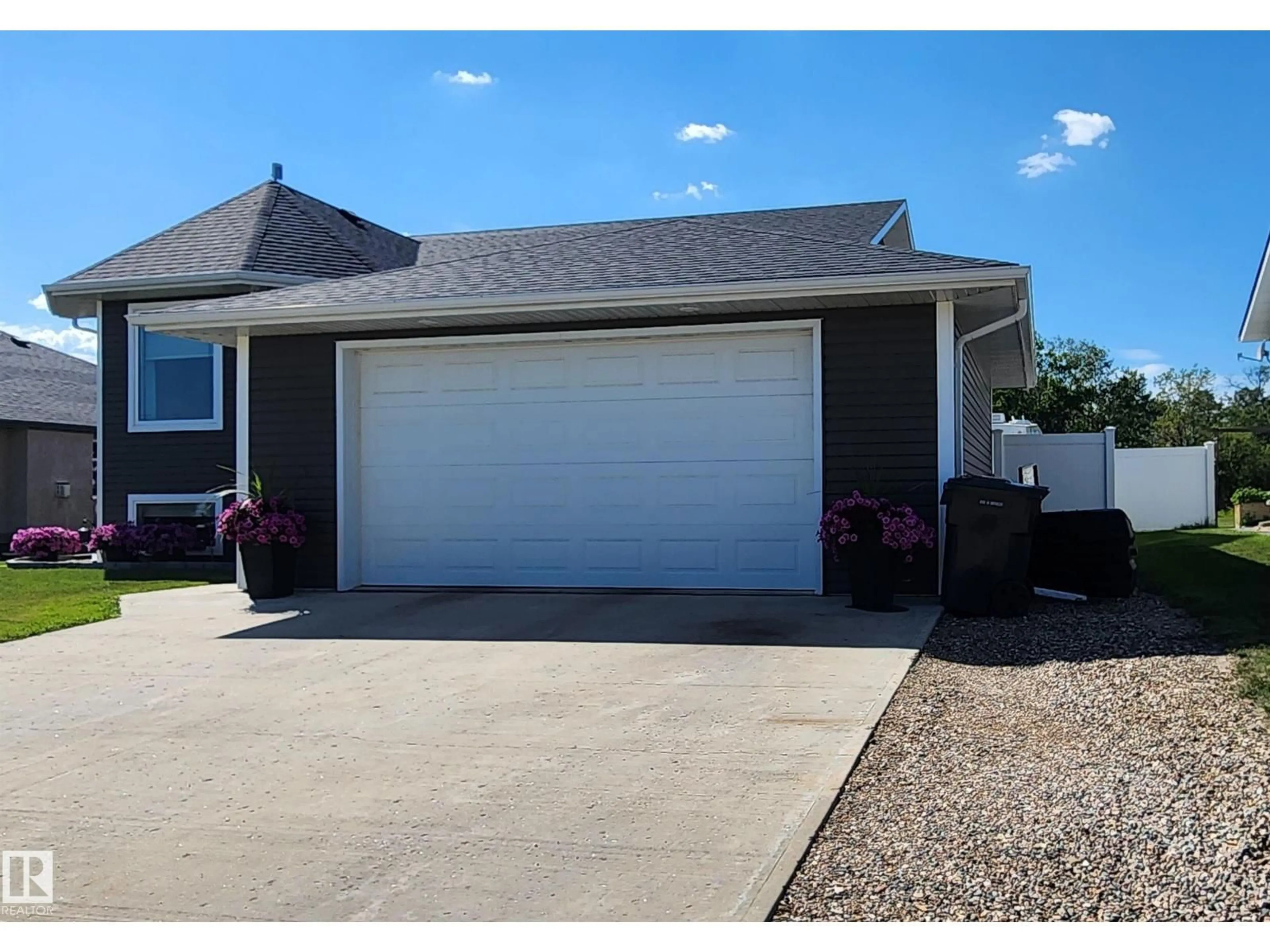 Home with vinyl exterior material, street for 5810 CENTENNIAL DR, Elk Point Alberta T0A1A0