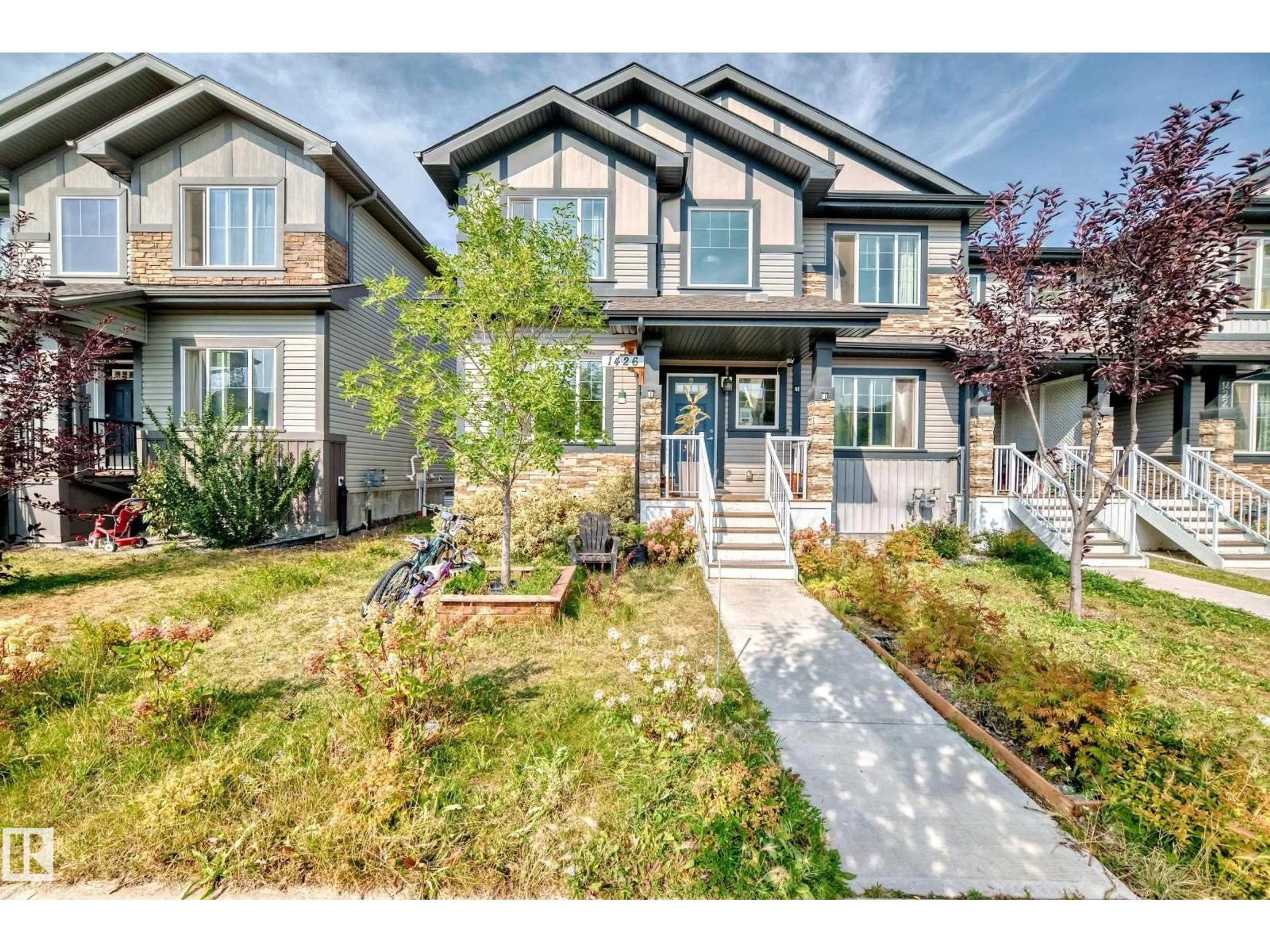 Home with vinyl exterior material, street for 1426 26 AV, Edmonton Alberta T6T0W1