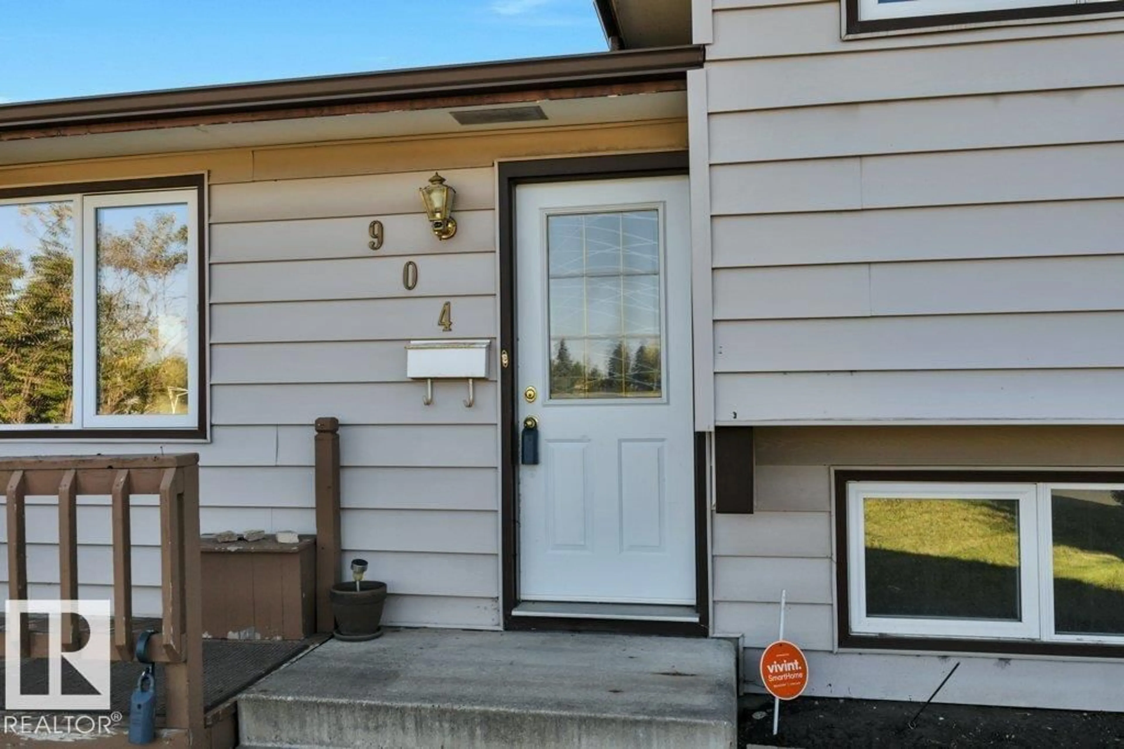 Home with vinyl exterior material, street for NW - 904 KNOTTWOOD S, Edmonton Alberta T6K3C3