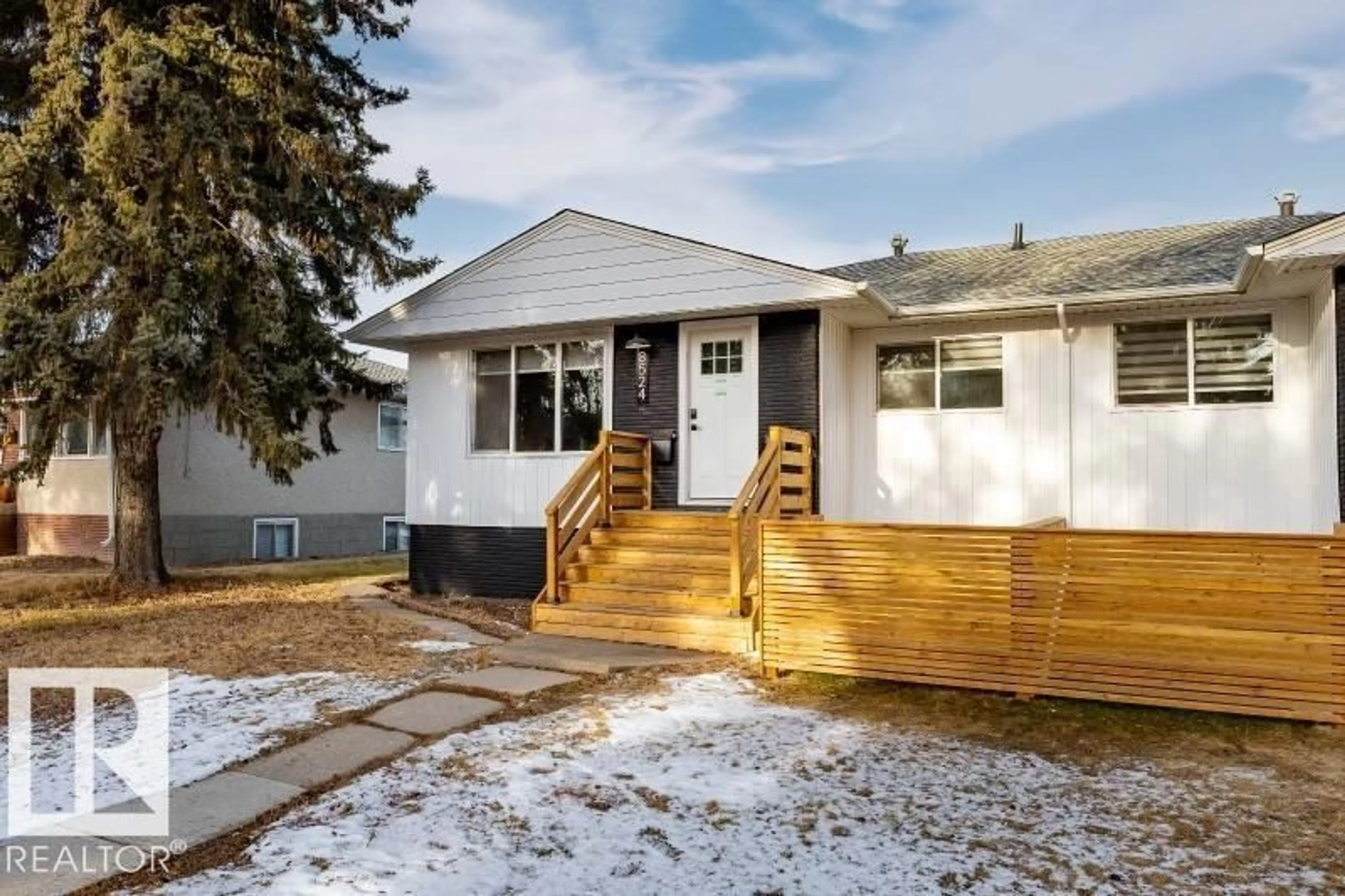 Home with vinyl exterior material, street for 8522 84 AV, Edmonton Alberta T6C1C9