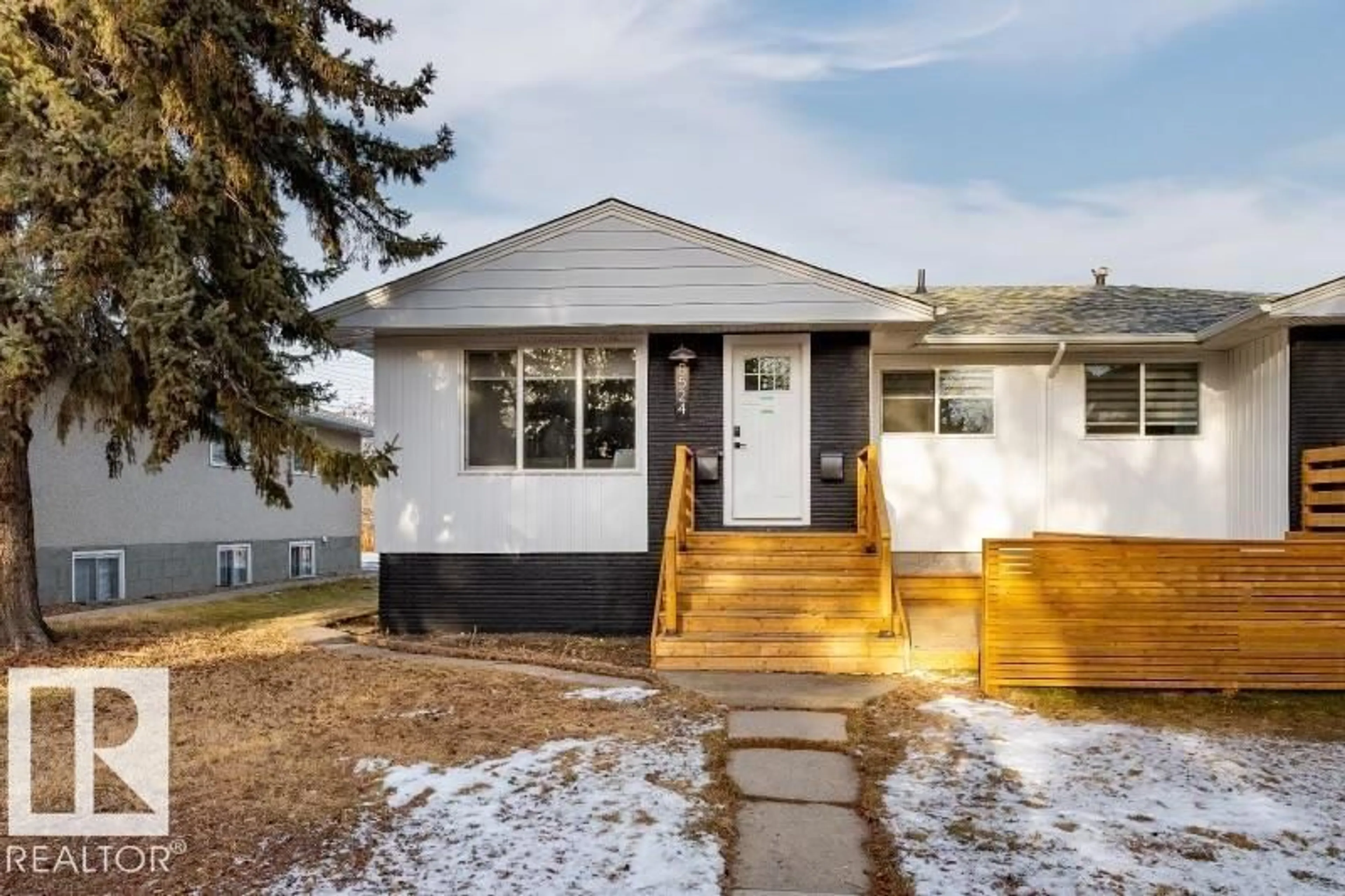 Home with vinyl exterior material, street for 8522 84 AV, Edmonton Alberta T6C1C9