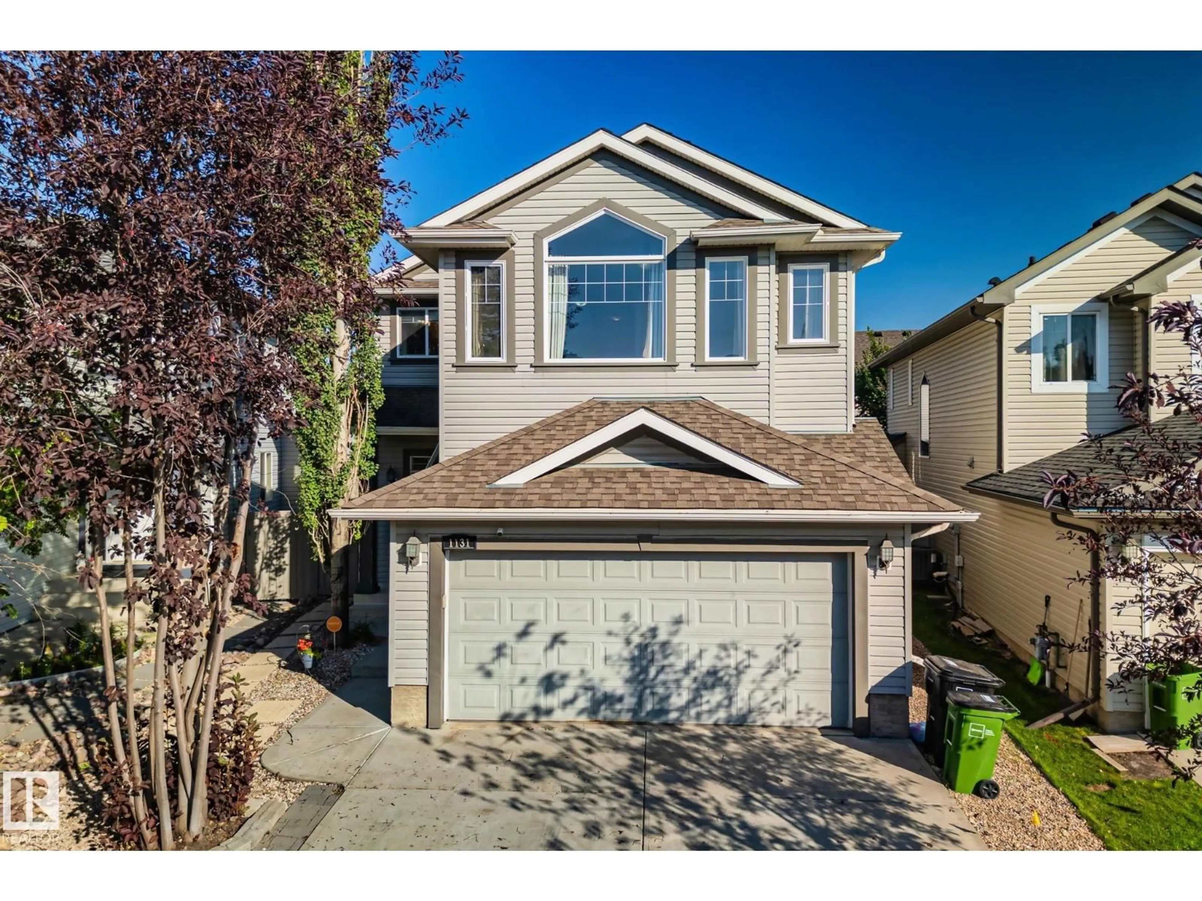 Home with vinyl exterior material, street for 1131 117 ST, Edmonton Alberta T6W1W9