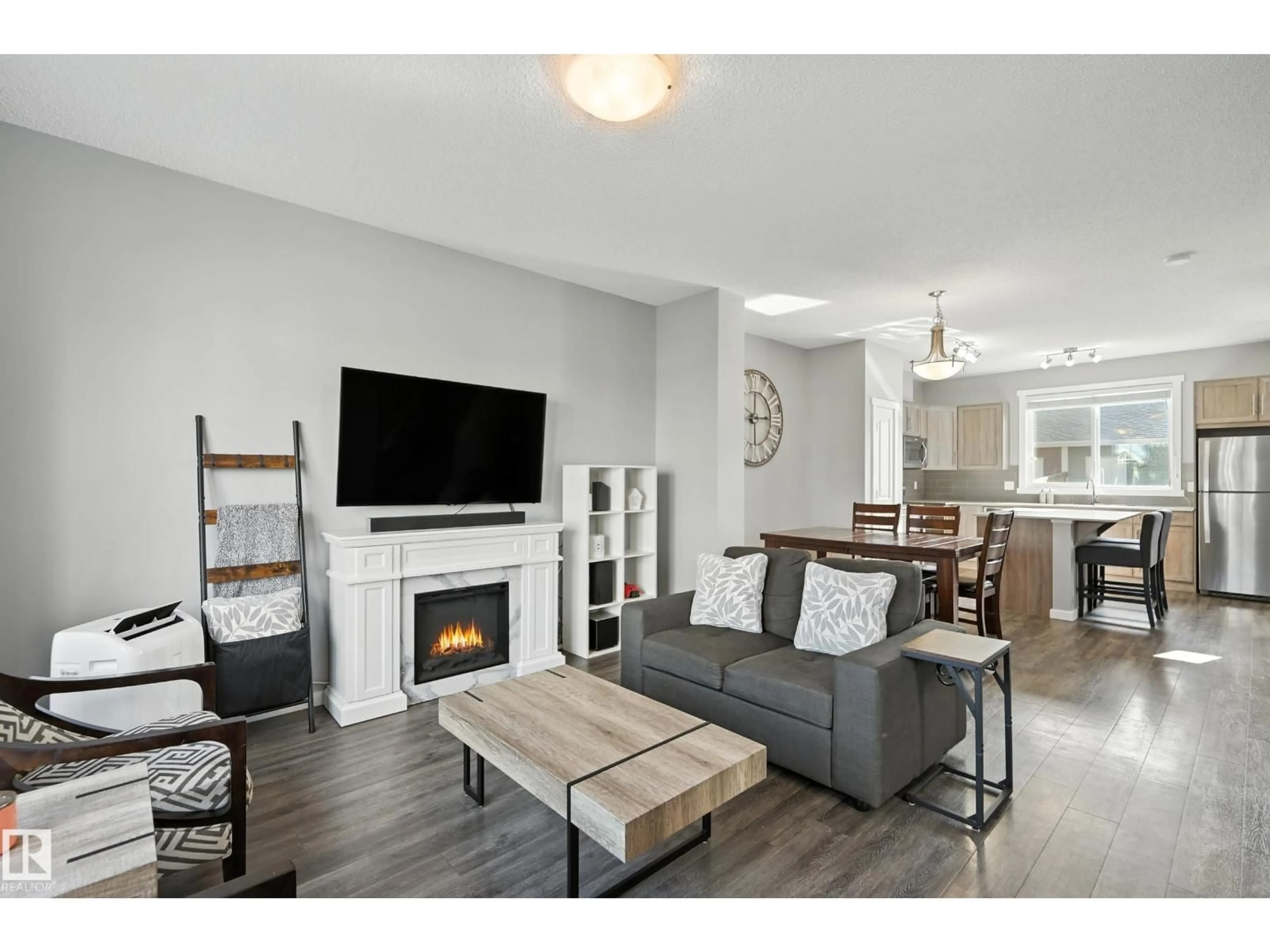 Living room with furniture, wood/laminate floor for 2677 MAPLE WY, Edmonton Alberta T6T2C8