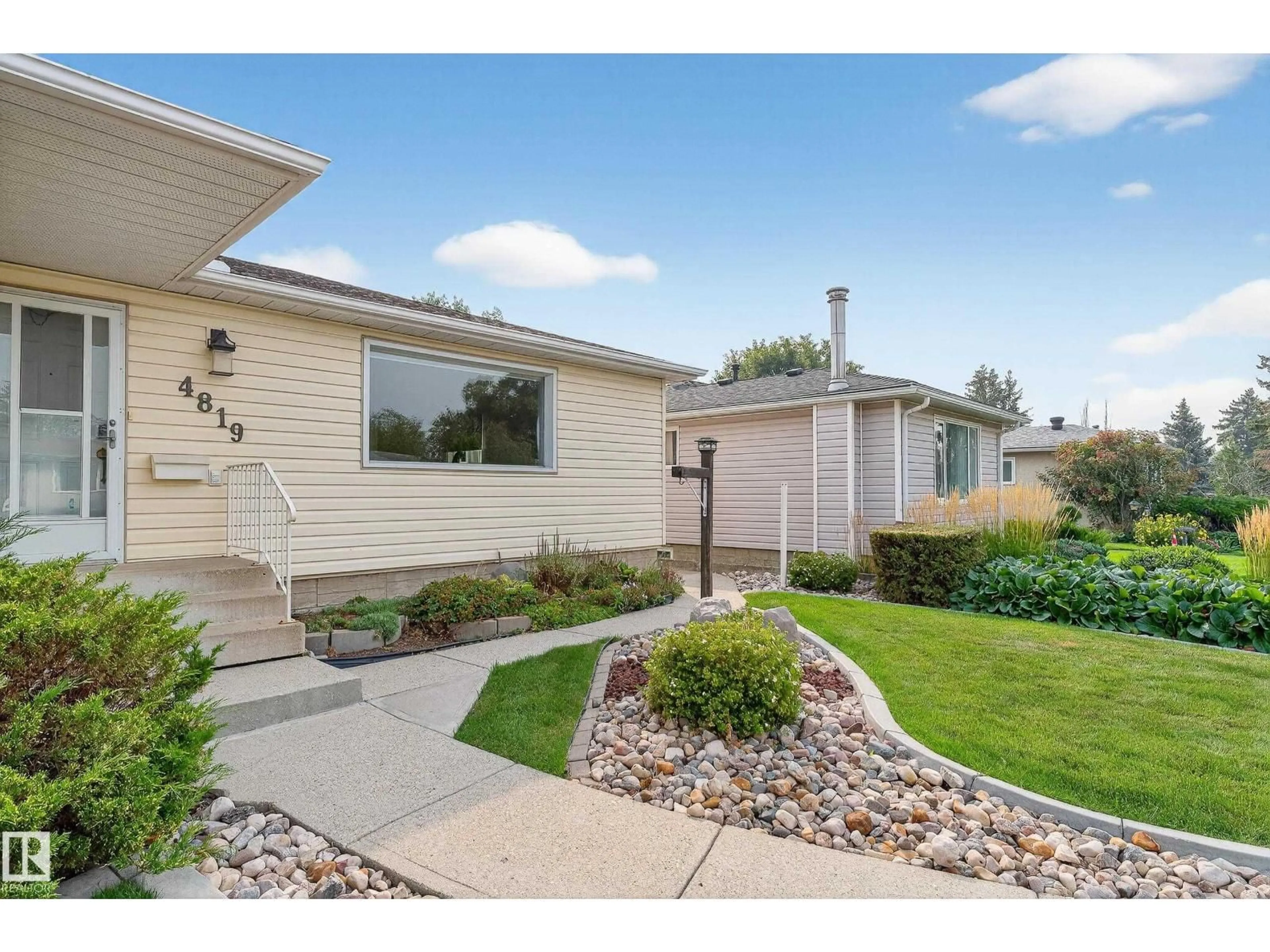 Home with vinyl exterior material, street for NW - 4819 105B ST, Edmonton Alberta T6H2R9