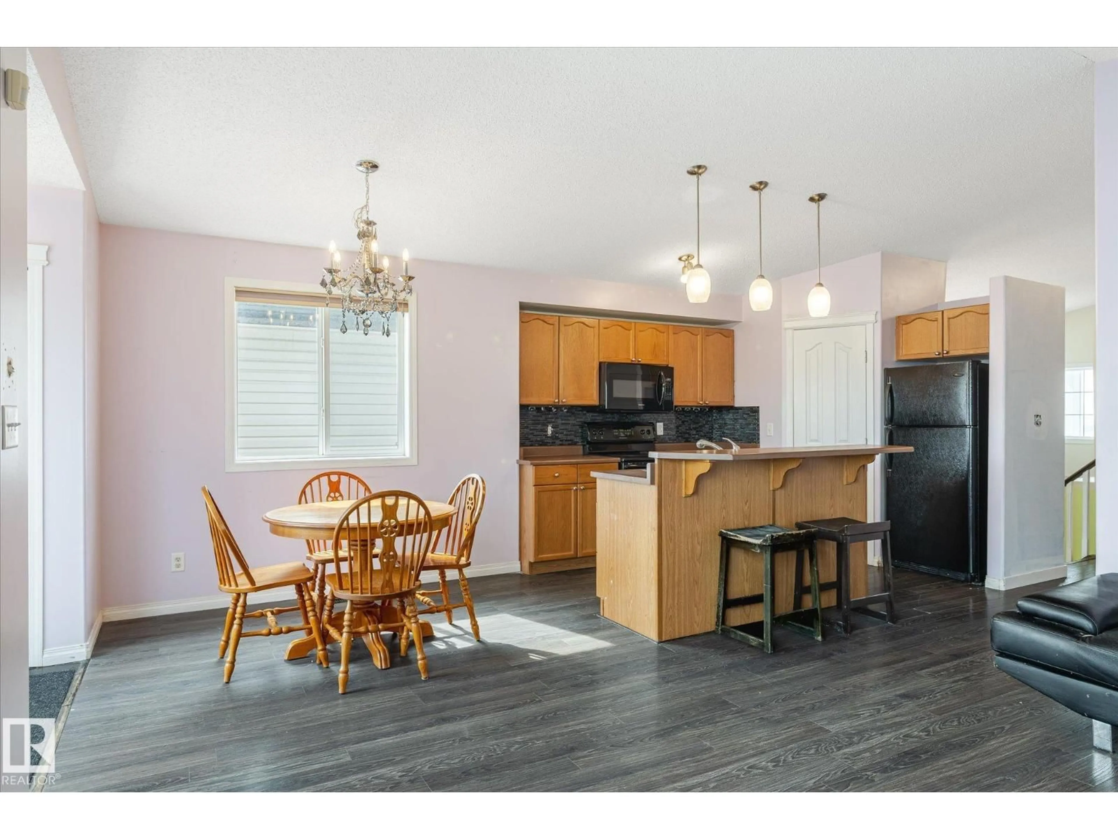Open concept kitchen, wood/laminate floor for 17707 90 ST, Edmonton Alberta T5Z0A2