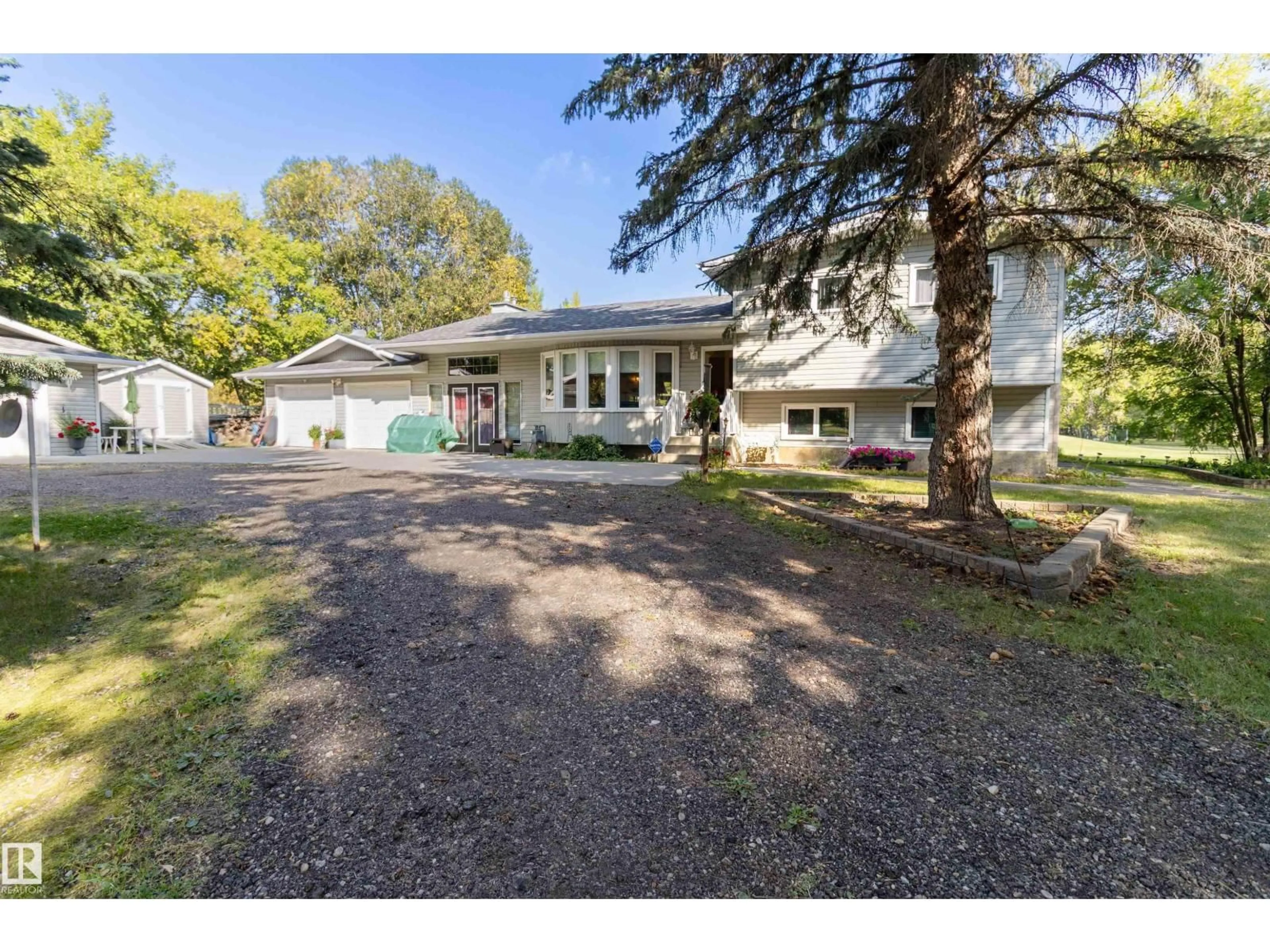 A pic from outside/outdoor area/front of a property/back of a property/a pic from drone, street for 12 51514 RGE ROAD 261, Rural Parkland County Alberta T7Y1B3