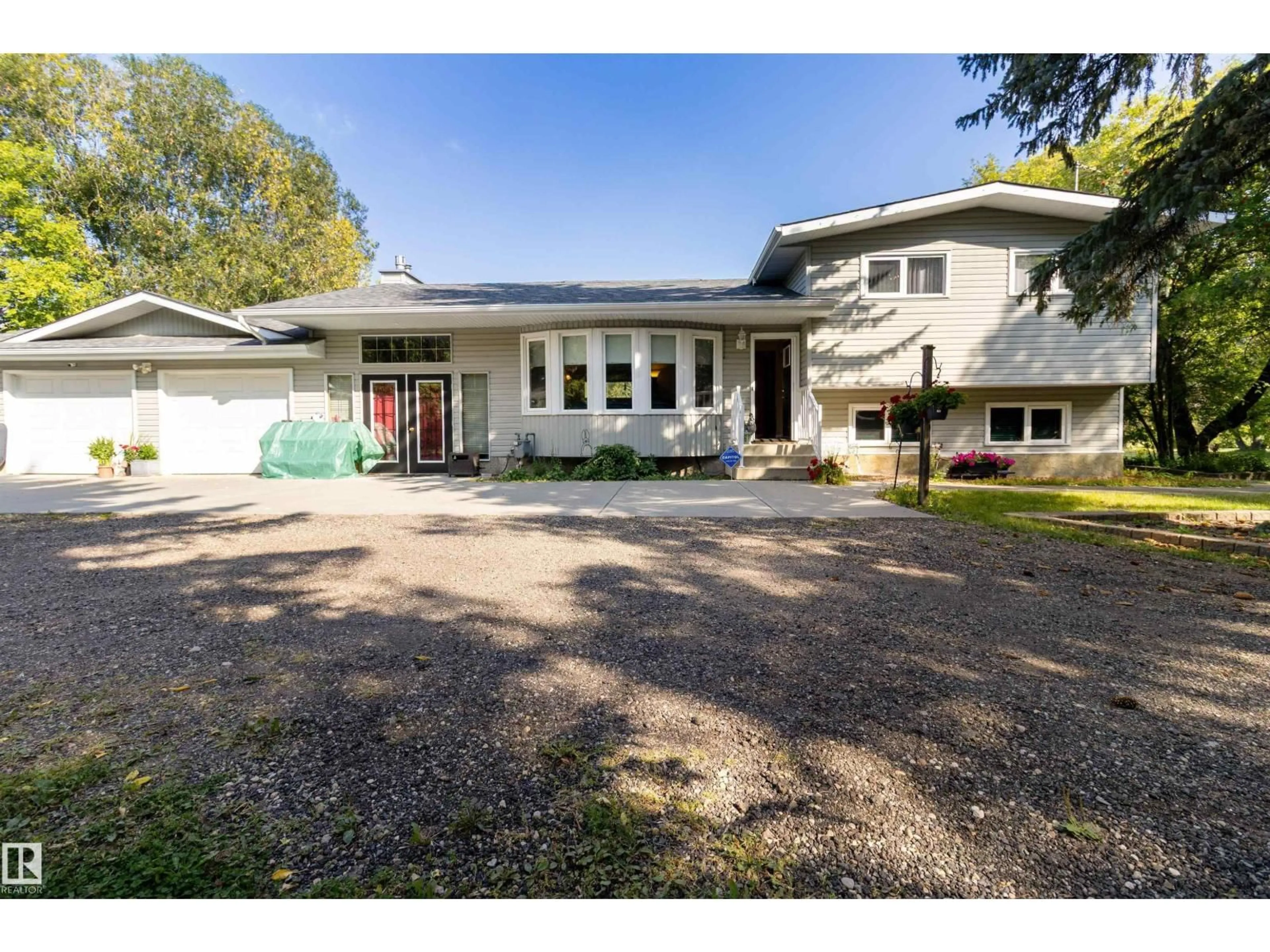 A pic from outside/outdoor area/front of a property/back of a property/a pic from drone, street for 12 51514 RGE ROAD 261, Rural Parkland County Alberta T7Y1B3