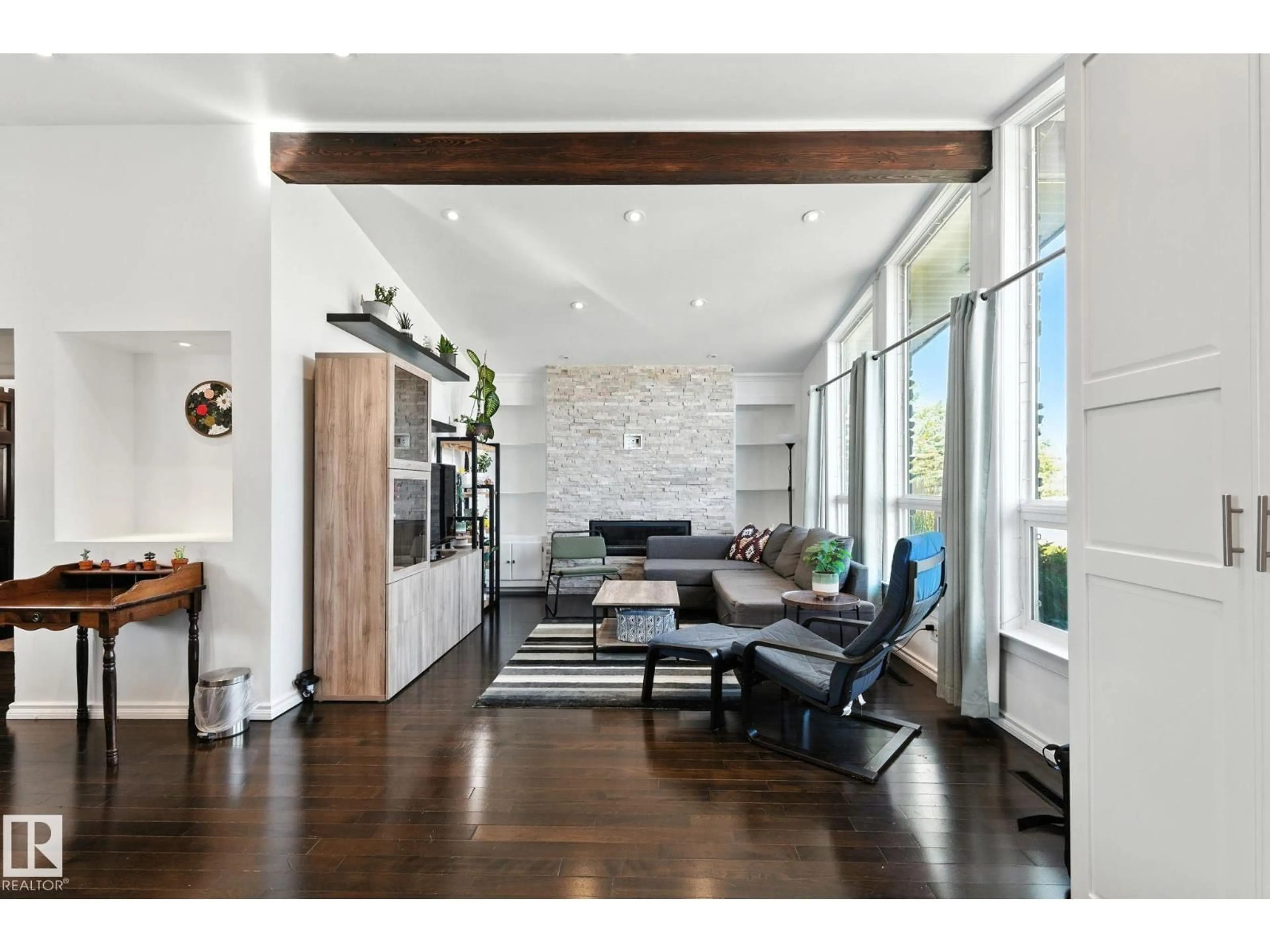 Living room with furniture, wood/laminate floor for 7923 131A AV, Edmonton Alberta T5C2A2