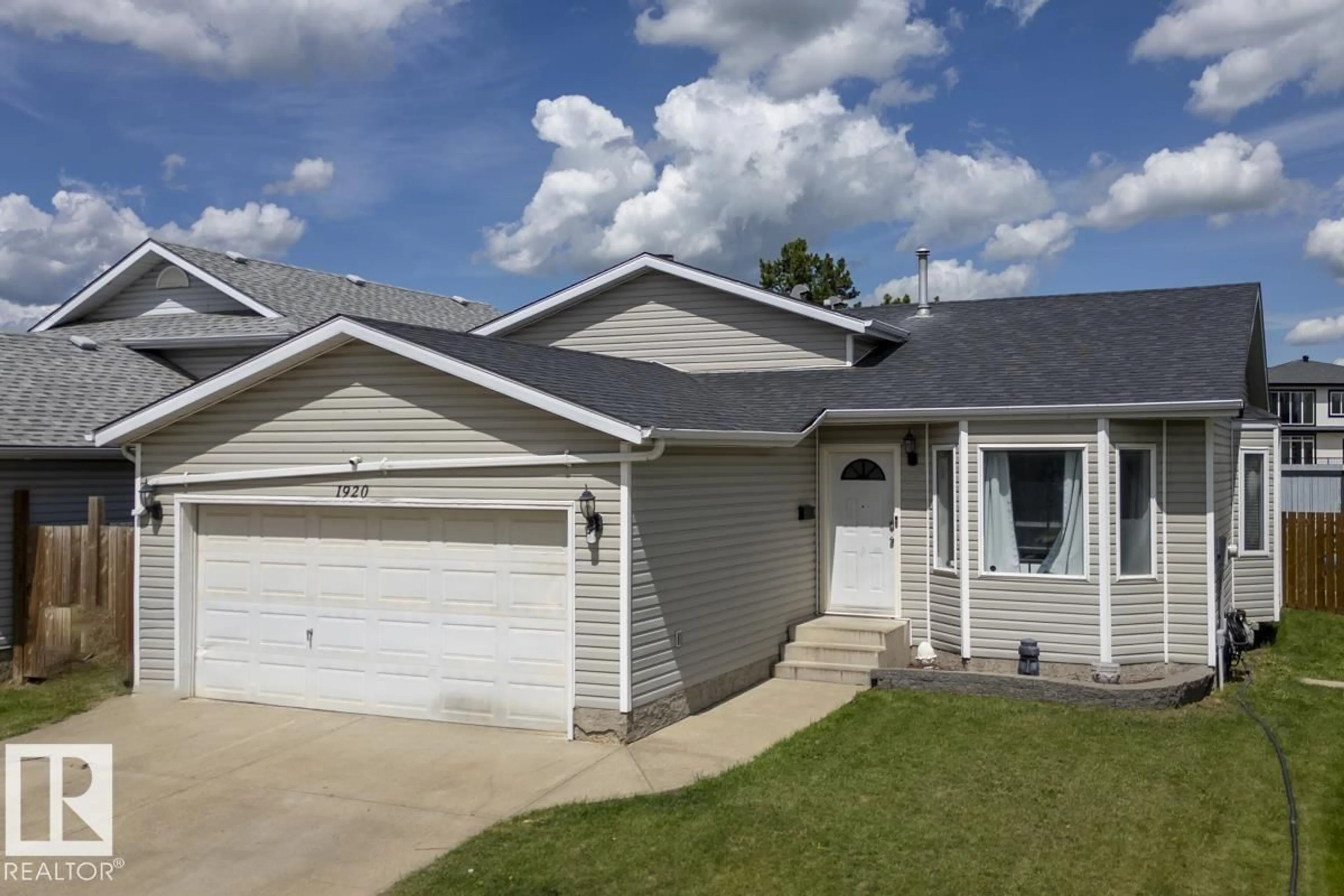 Home with vinyl exterior material, street for 1920 152 AV, Edmonton Alberta T5R2R7