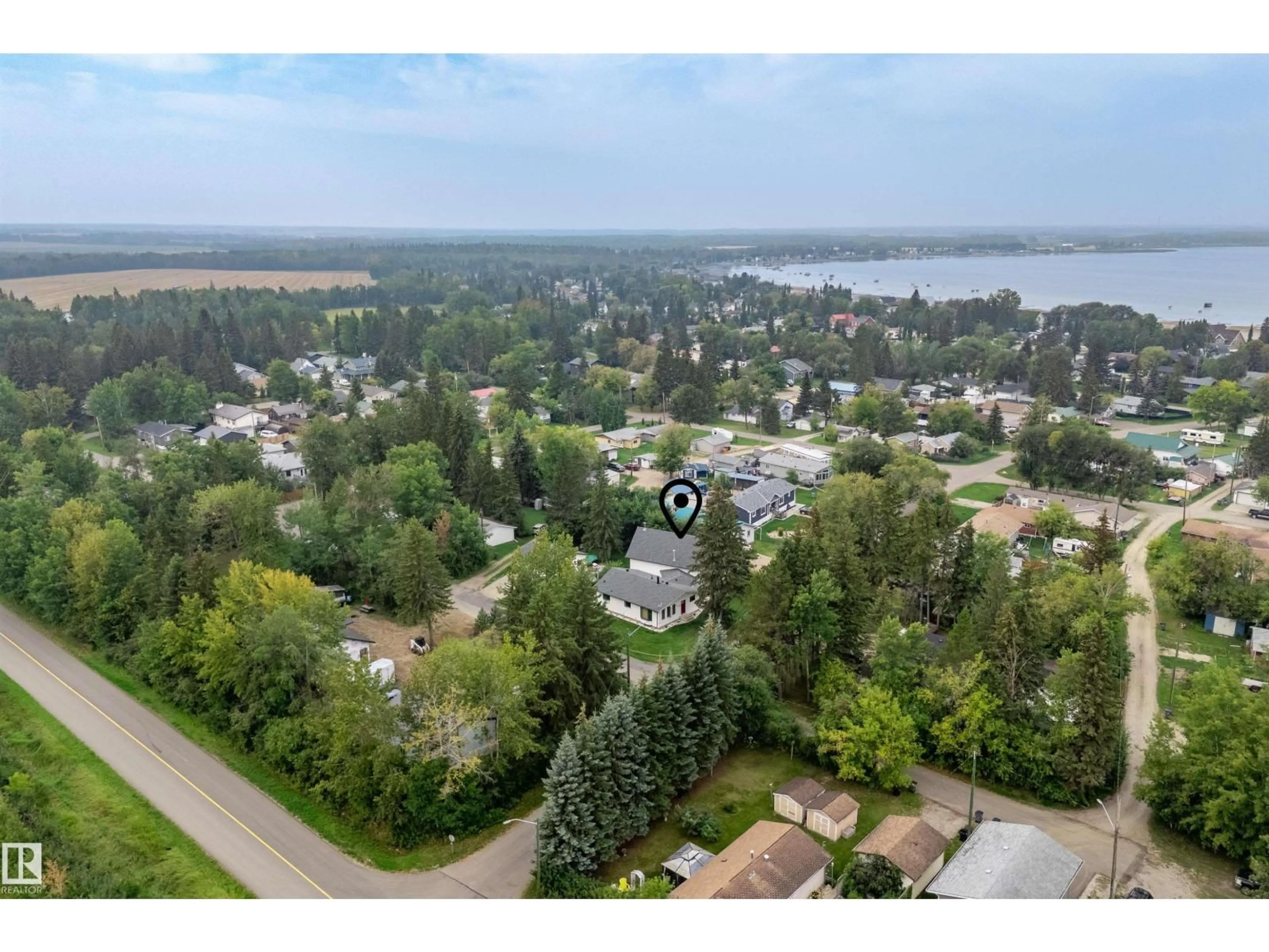 A pic from outside/outdoor area/front of a property/back of a property/a pic from drone, water/lake/river/ocean view for 4704 51 ST, Rural Lac Ste. Anne County Alberta T0E0A0