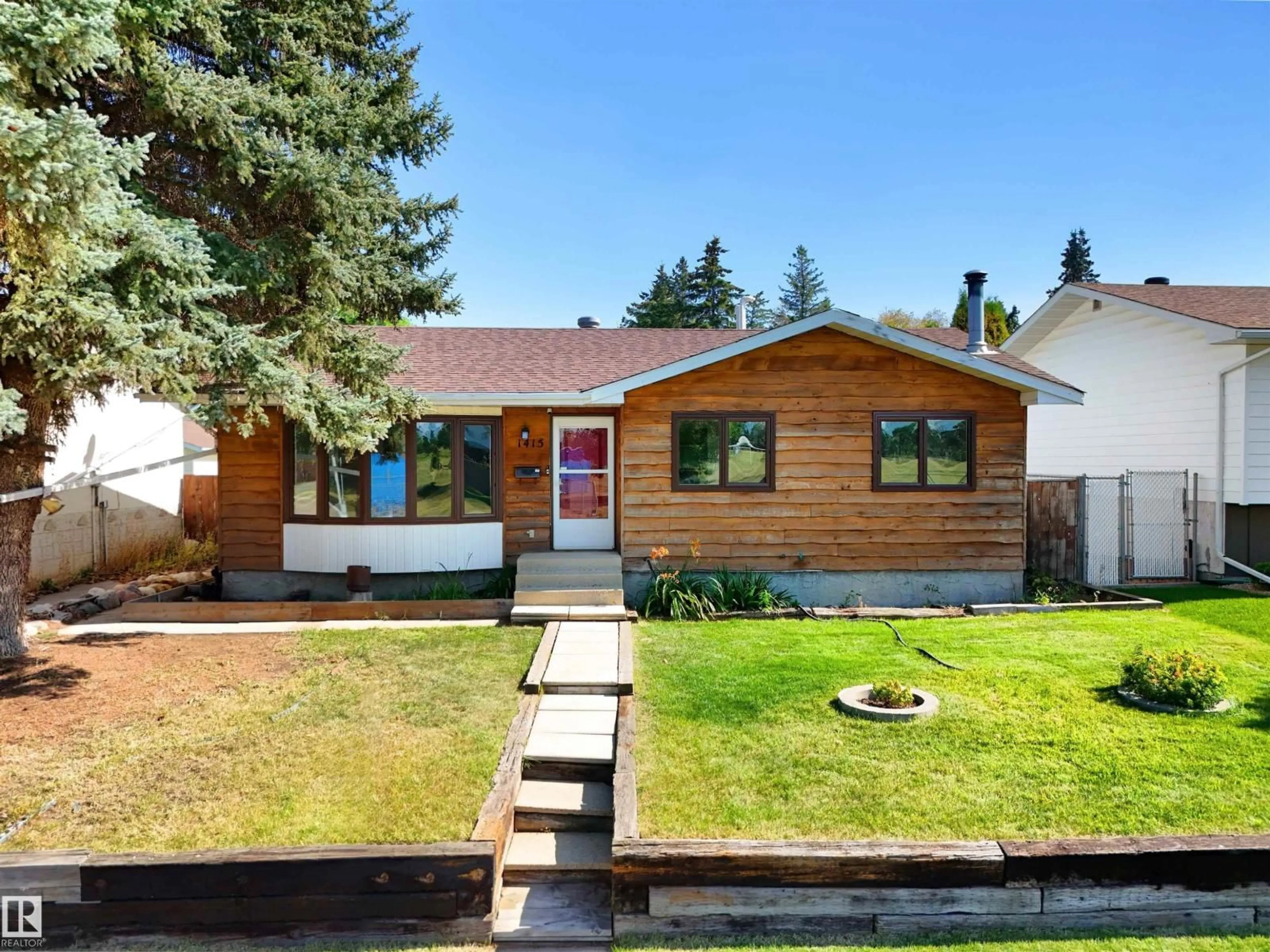 Home with vinyl exterior material, street for NW - 1415 80 ST, Edmonton Alberta T6K2R3