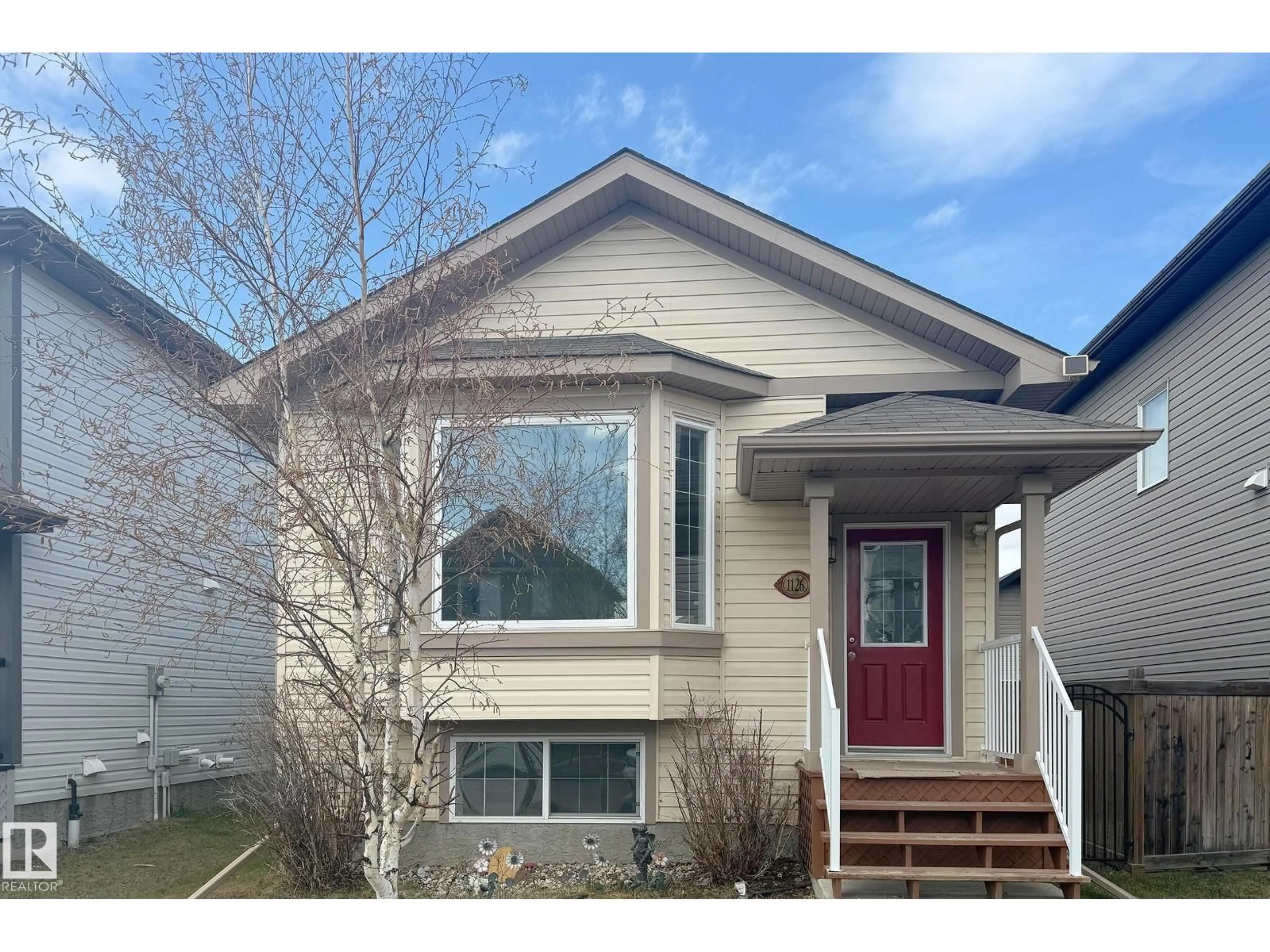 Home with vinyl exterior material, street for 1126 36A AV, Edmonton Alberta T6T0G1