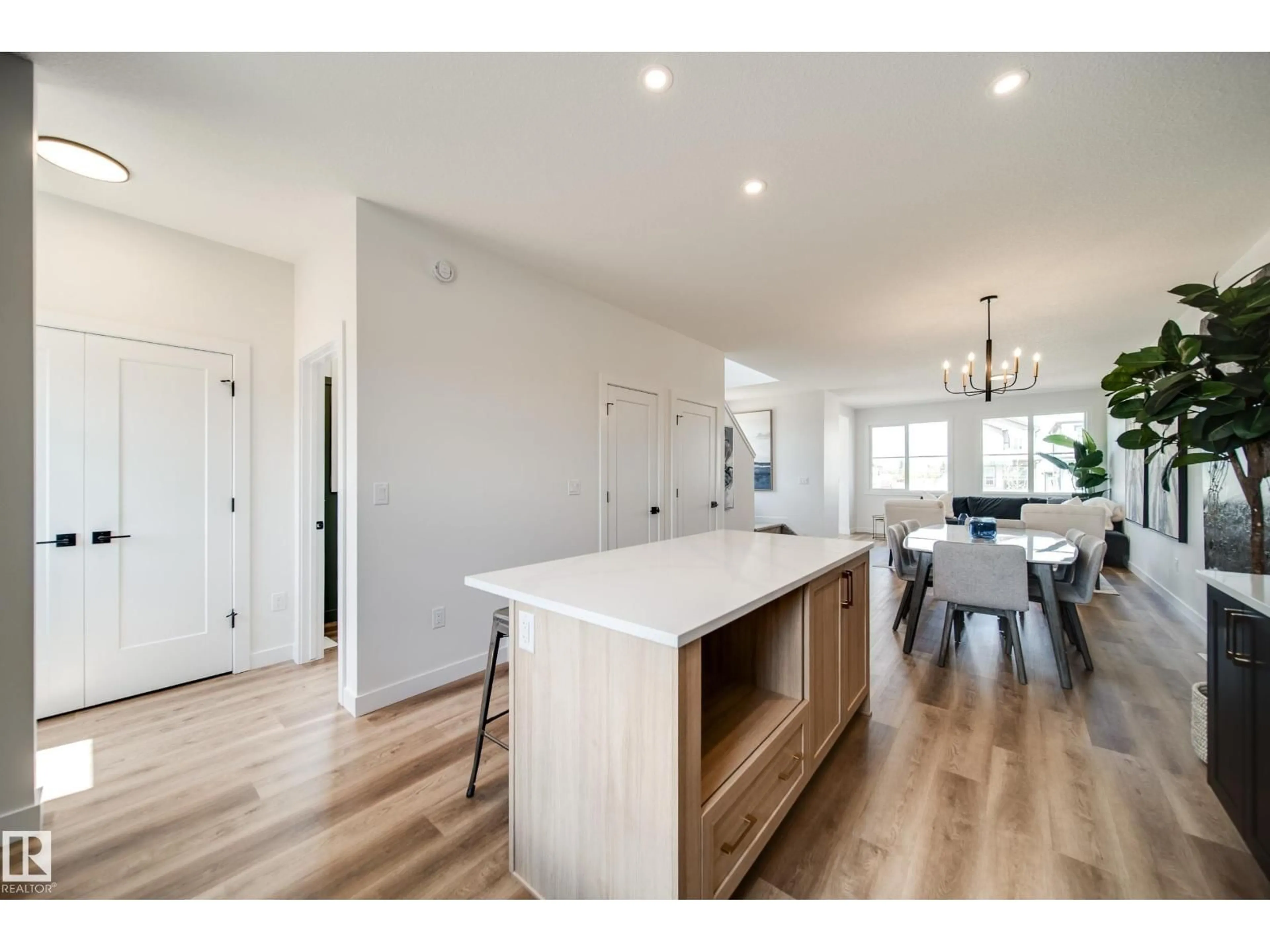 Open concept kitchen, wood/laminate floor for 61 SIENNA BV, Fort Saskatchewan Alberta T8L0W3