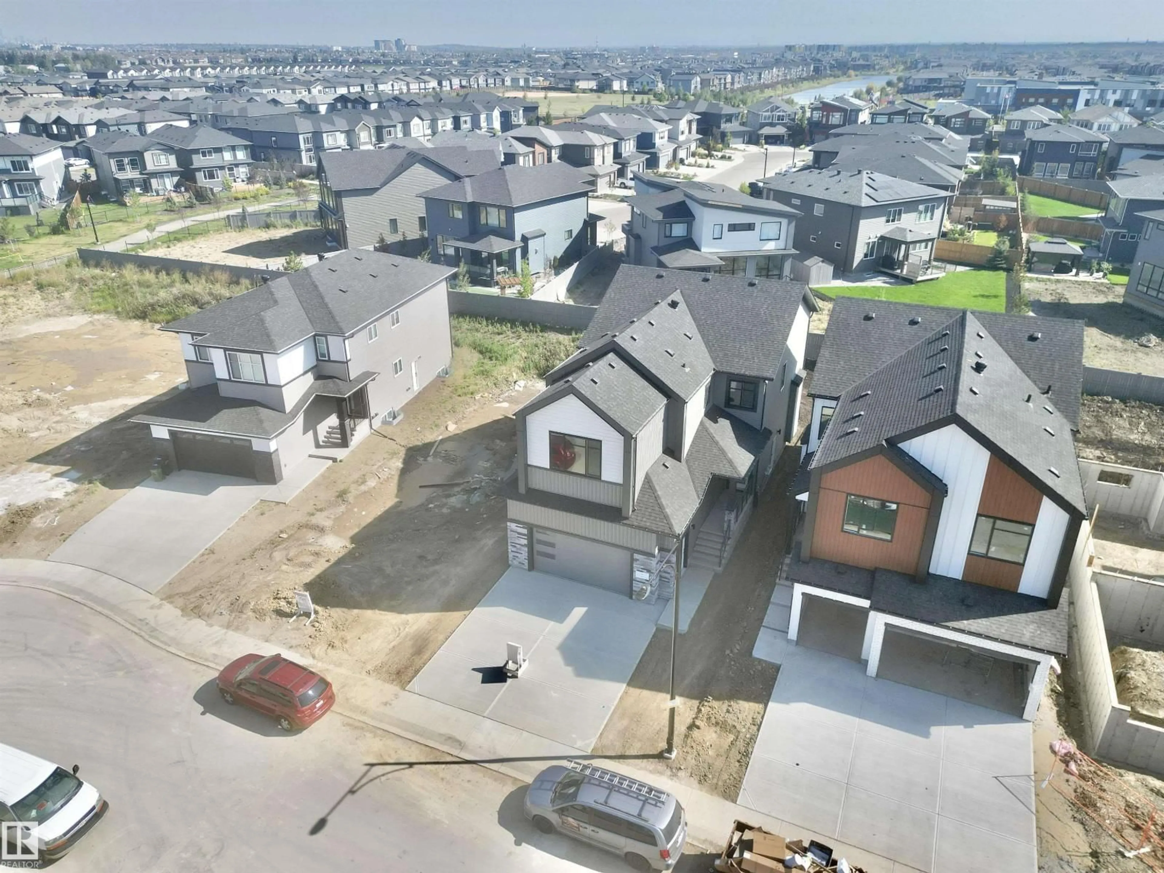 A pic from outside/outdoor area/front of a property/back of a property/a pic from drone, street for SW - 7027 KIVIAQ CR, Edmonton Alberta T6W5R2
