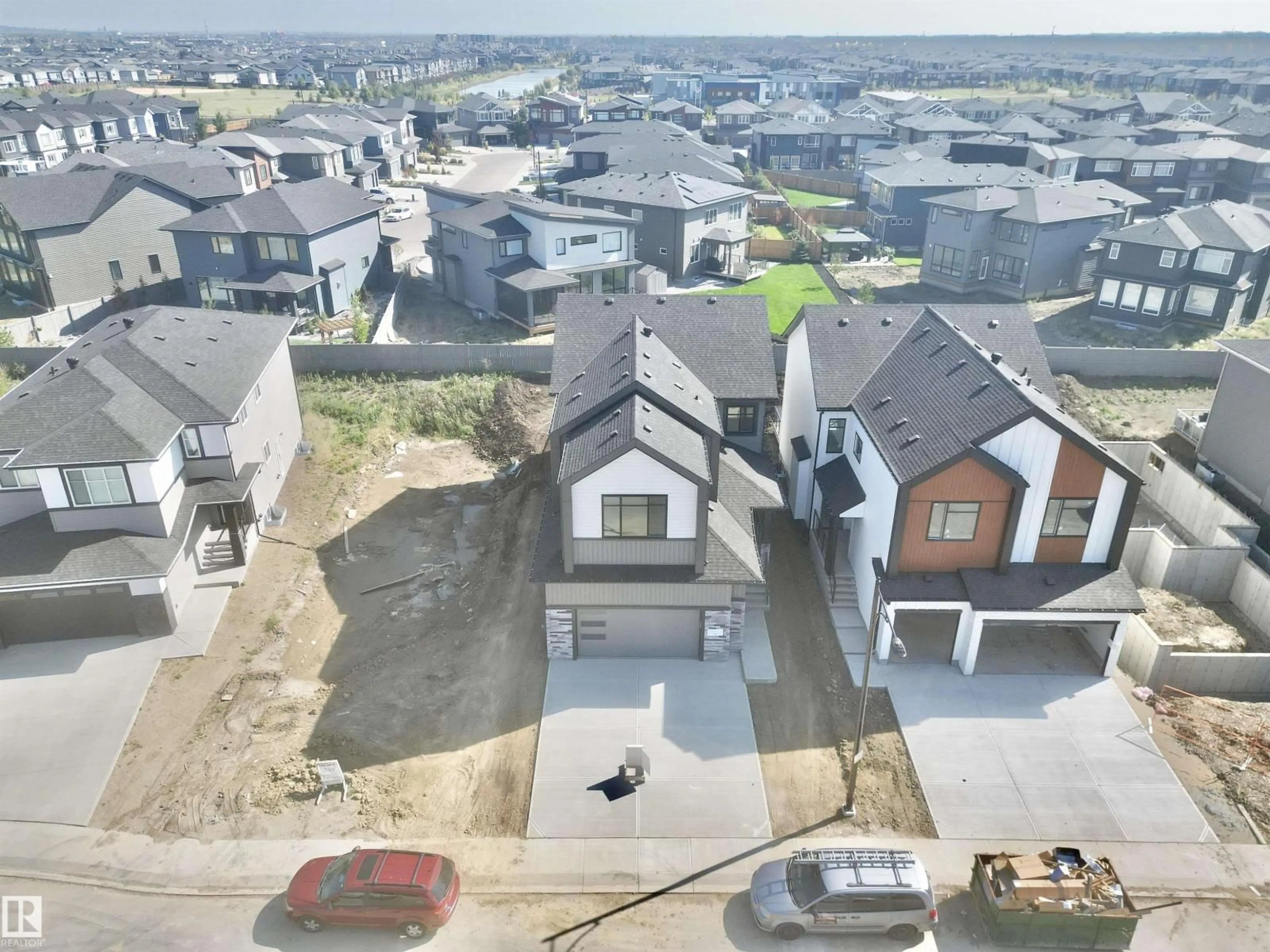 A pic from outside/outdoor area/front of a property/back of a property/a pic from drone, street for SW - 7027 KIVIAQ CR, Edmonton Alberta T6W5R2