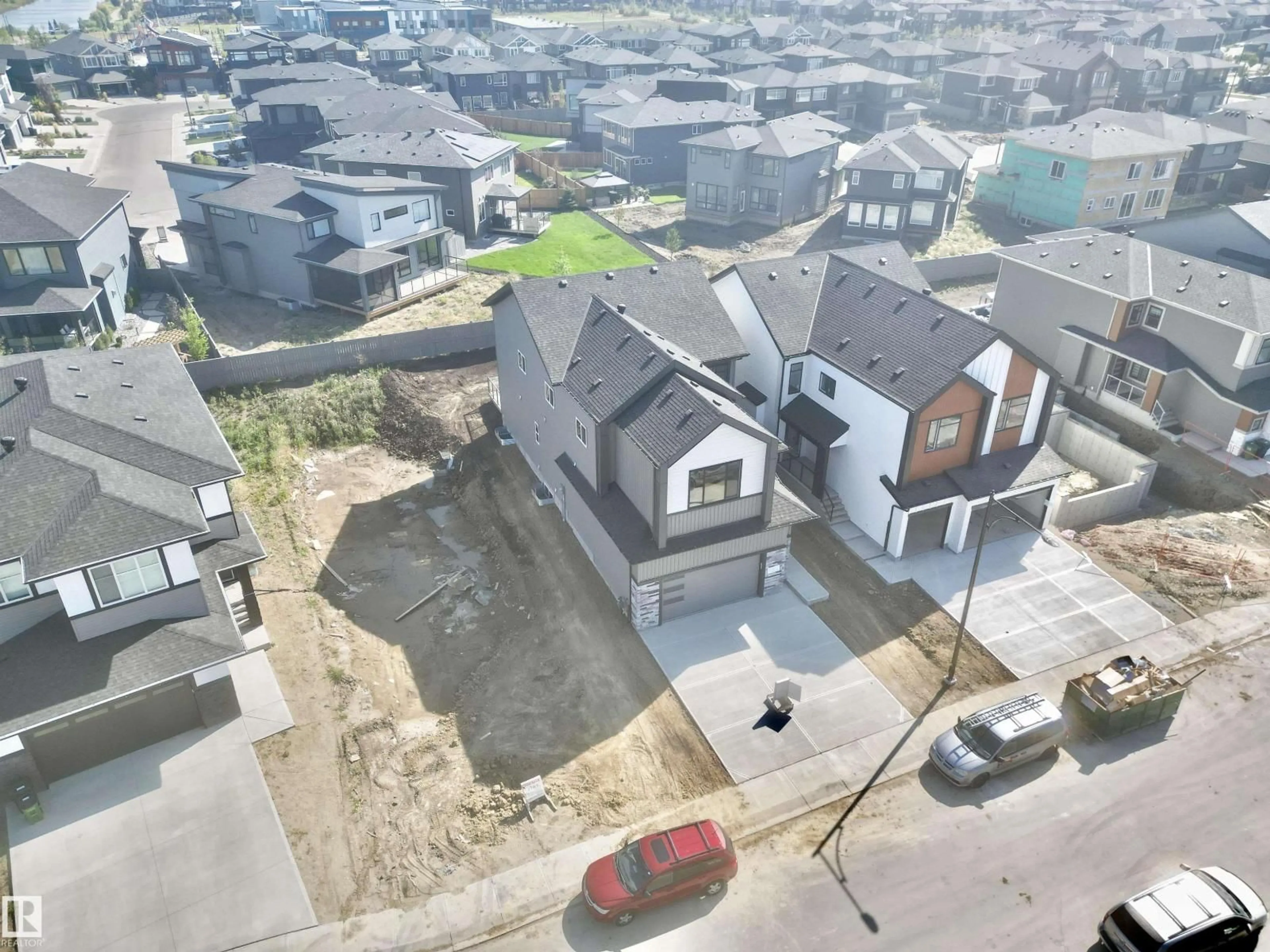 A pic from outside/outdoor area/front of a property/back of a property/a pic from drone, street for SW - 7027 KIVIAQ CR, Edmonton Alberta T6W5R2