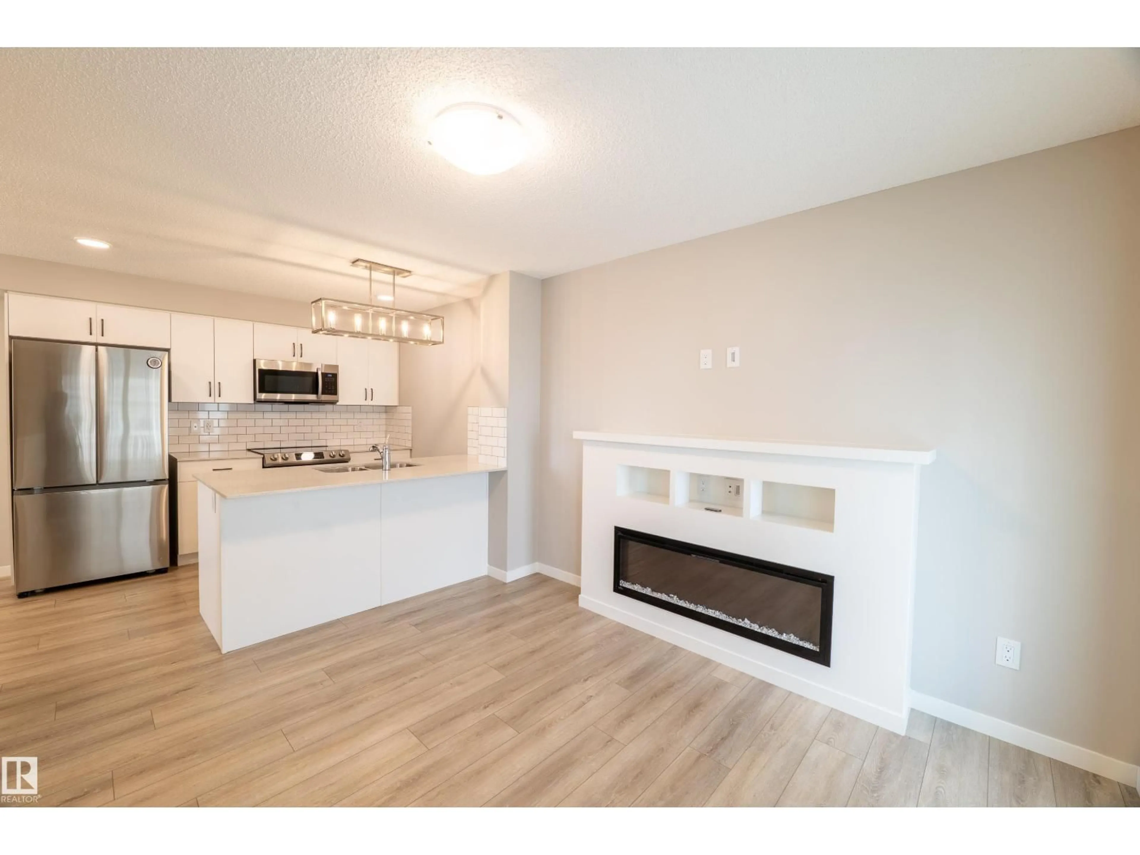 Open concept kitchen, wood/laminate floor for 78 - 17832 78 ST NW, Edmonton Alberta T5Z0P7