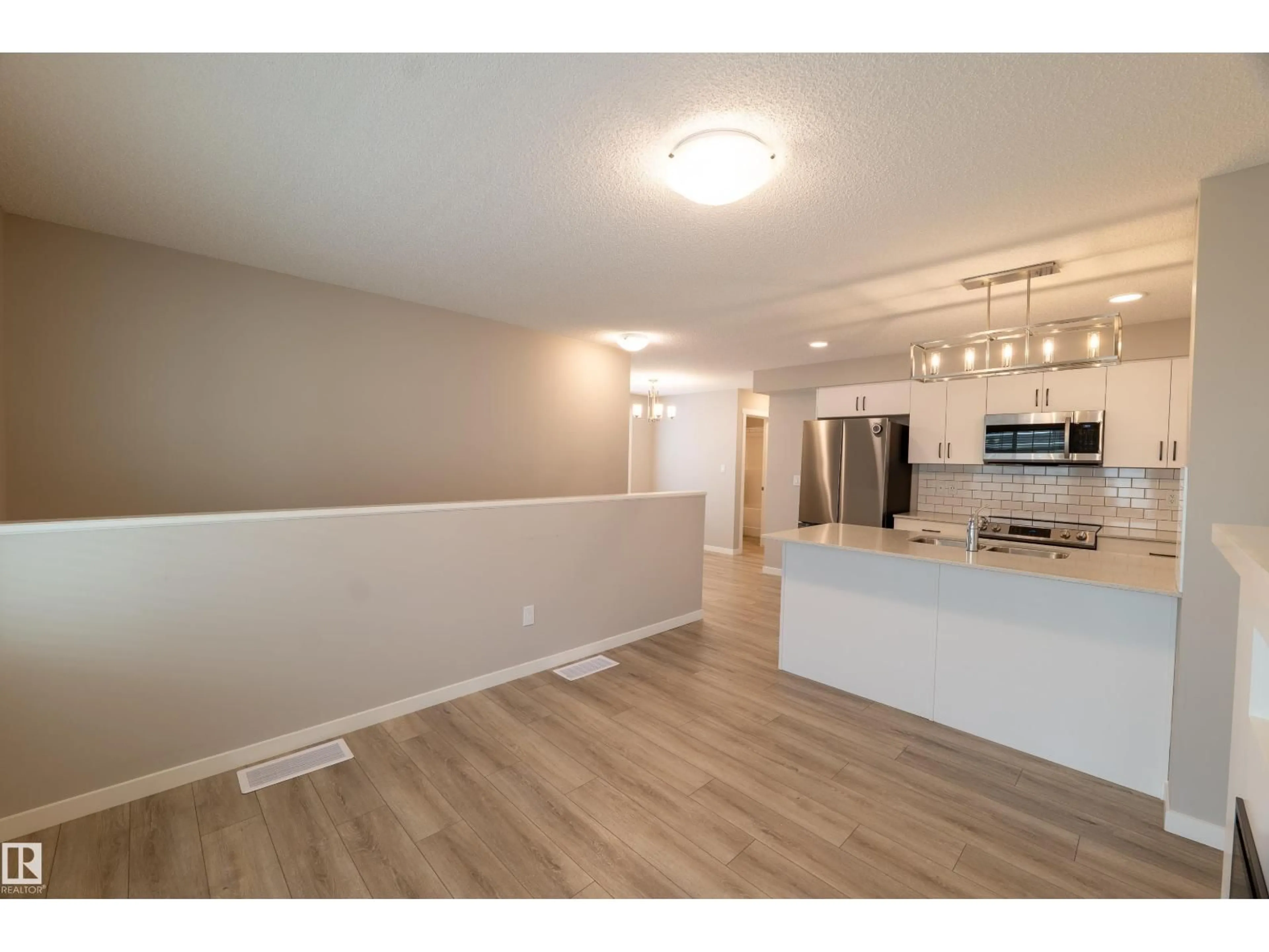 Open concept kitchen, wood/laminate floor for 78 - 17832 78 ST NW, Edmonton Alberta T5Z0P7