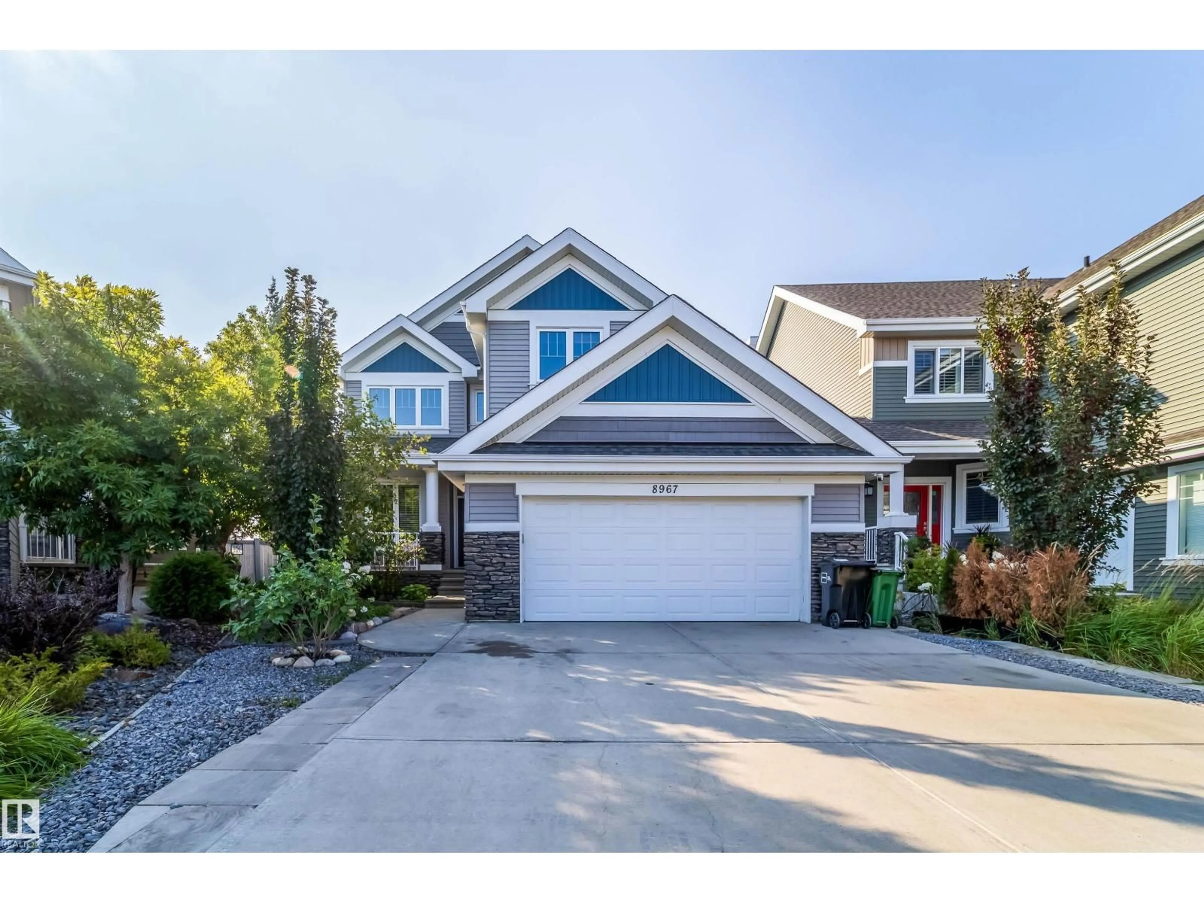 Home with vinyl exterior material, street for SW - 8967 24 AV, Edmonton Alberta T6X1A6