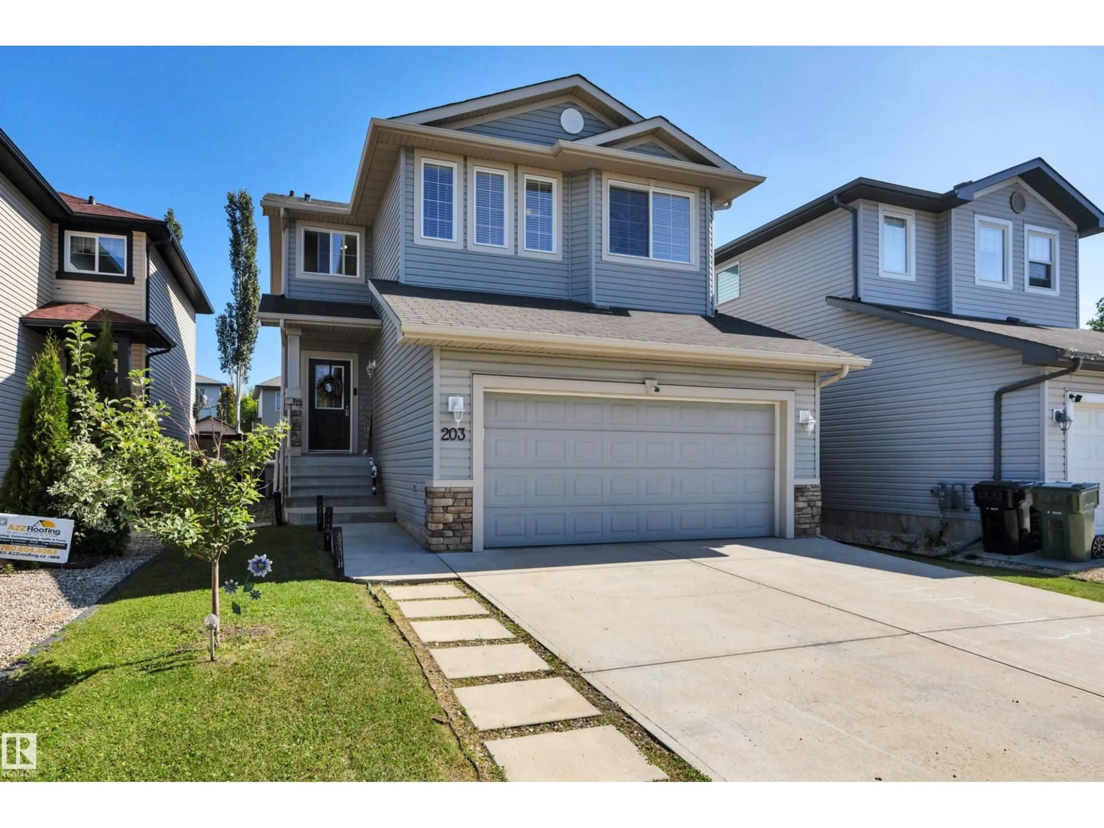 Home with vinyl exterior material, street for 203 AVENA CI, Leduc Alberta T9E0L7