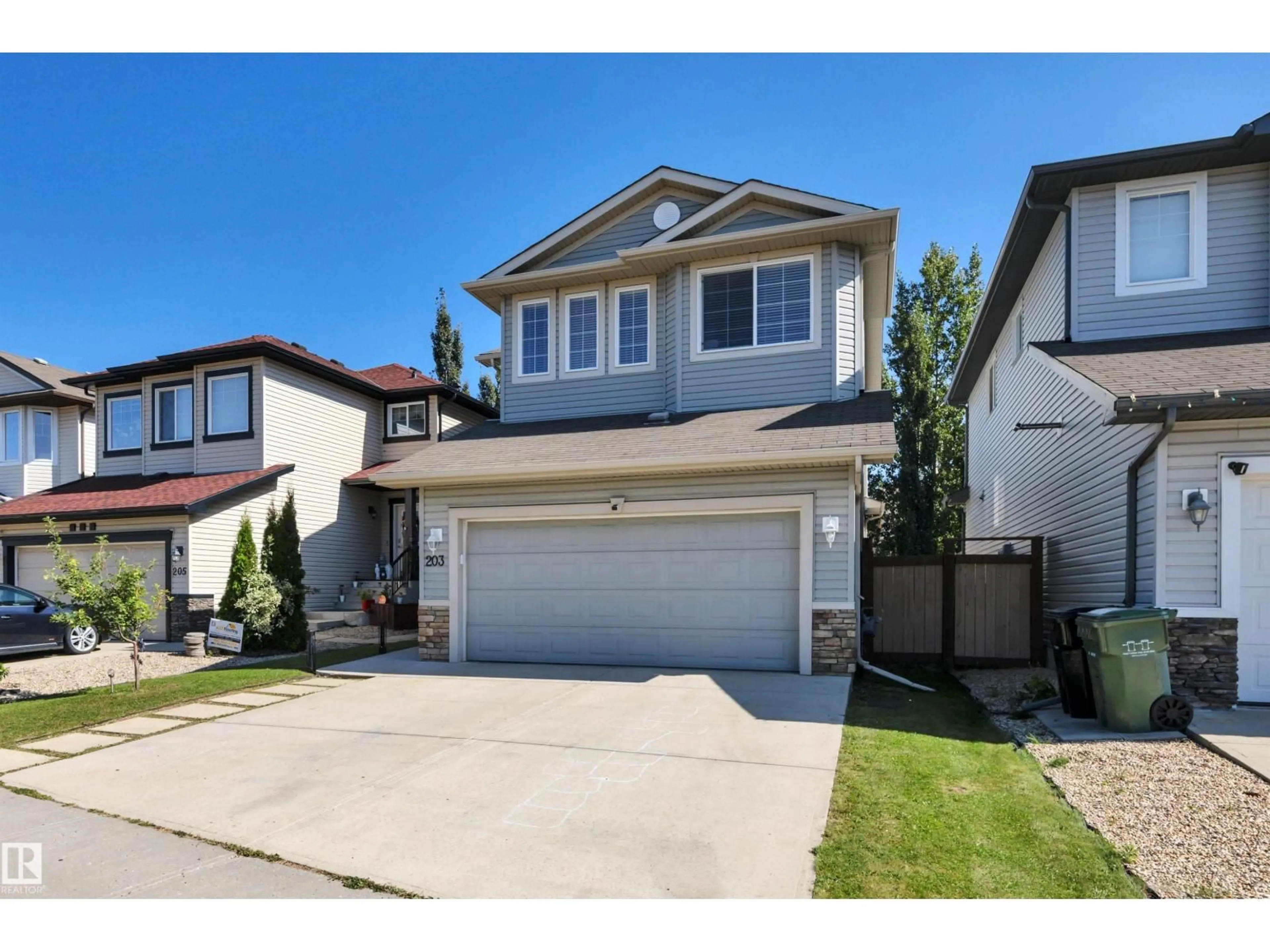 Home with vinyl exterior material, street for 203 AVENA CI, Leduc Alberta T9E0L7