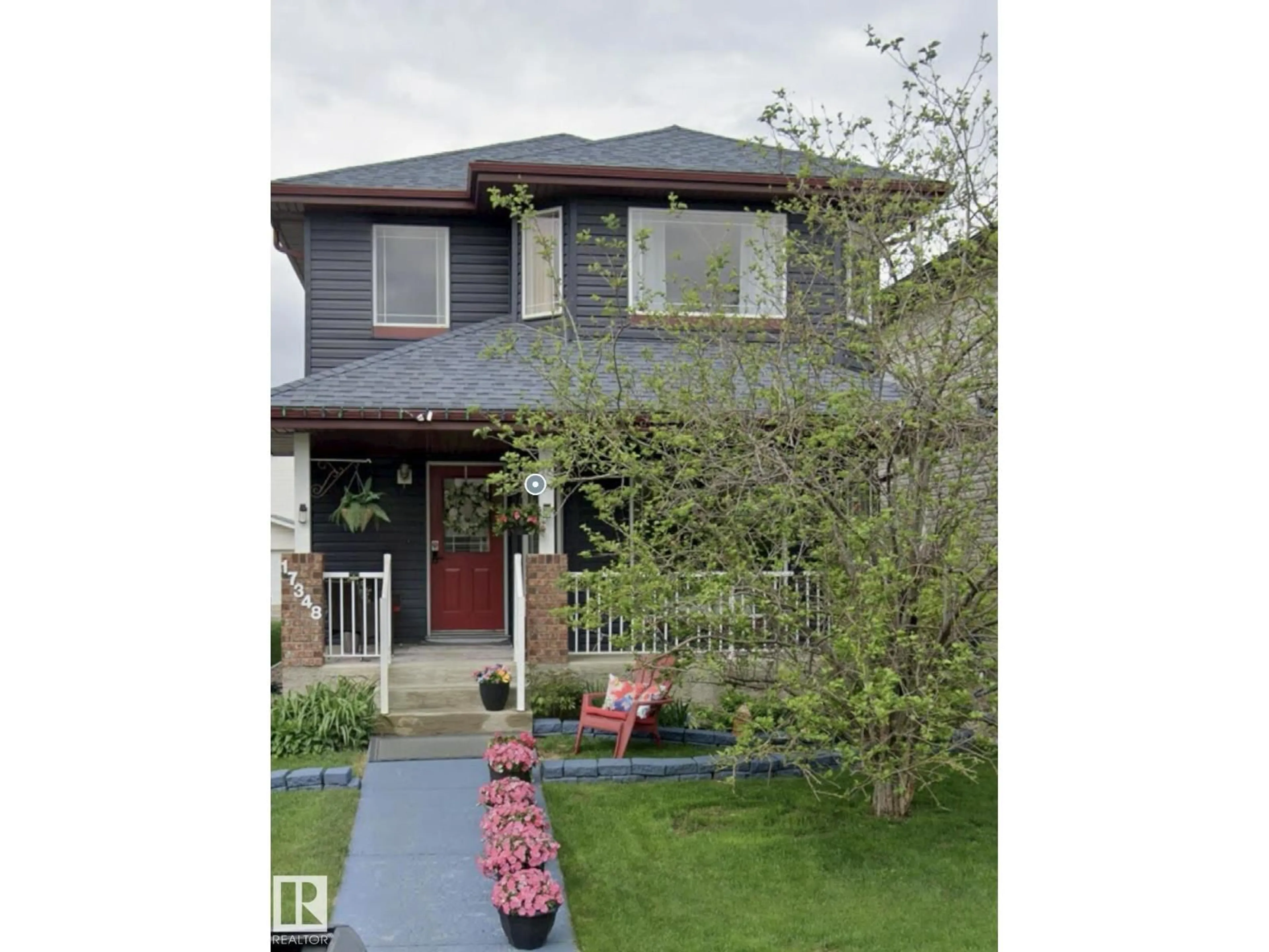 Home with vinyl exterior material, street for 17348 90 ST, Edmonton Alberta T5Z3W6
