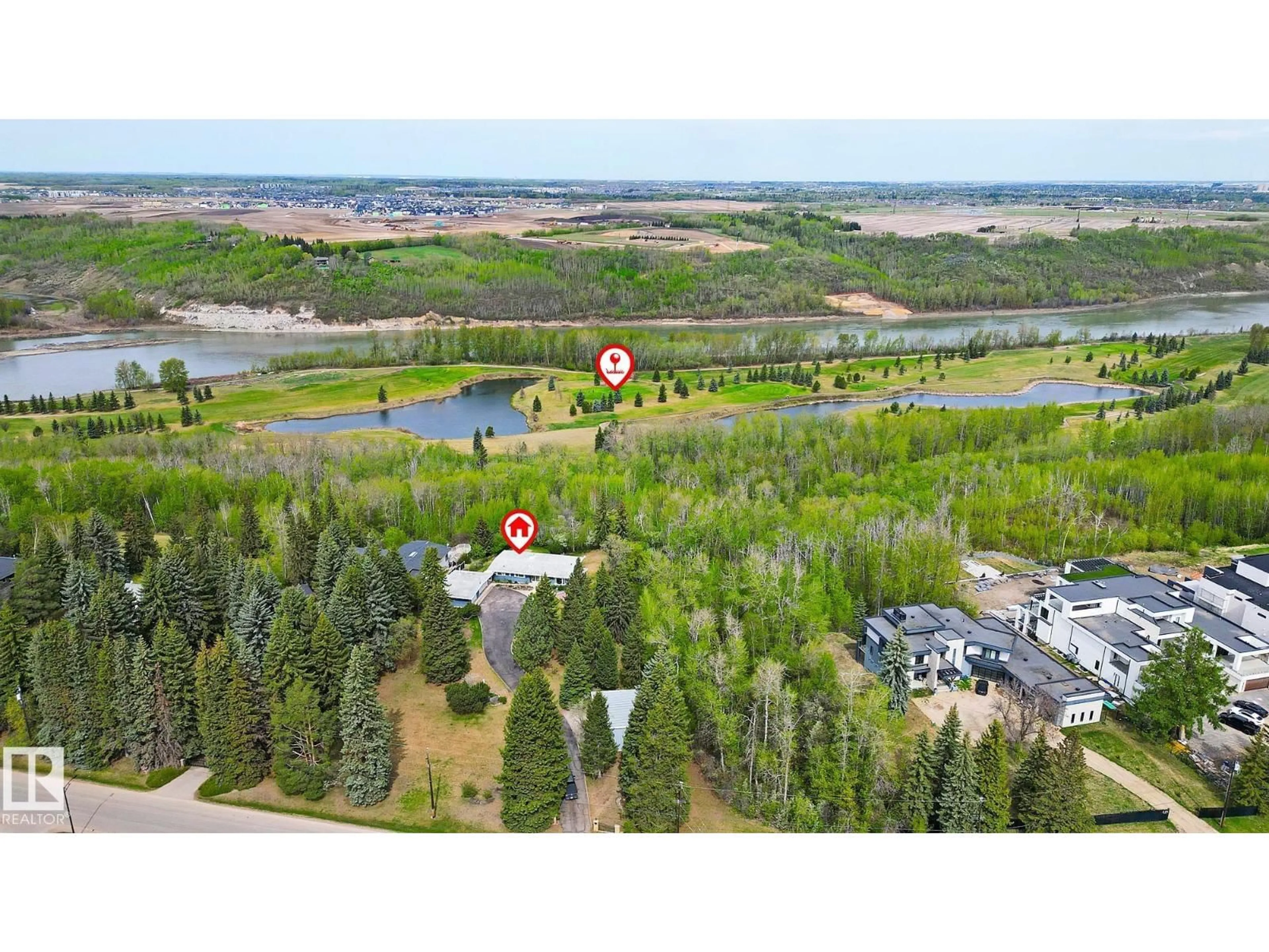 A pic from outside/outdoor area/front of a property/back of a property/a pic from drone, water/lake/river/ocean view for 140 WINDERMERE DR, Edmonton Alberta T6W0S4