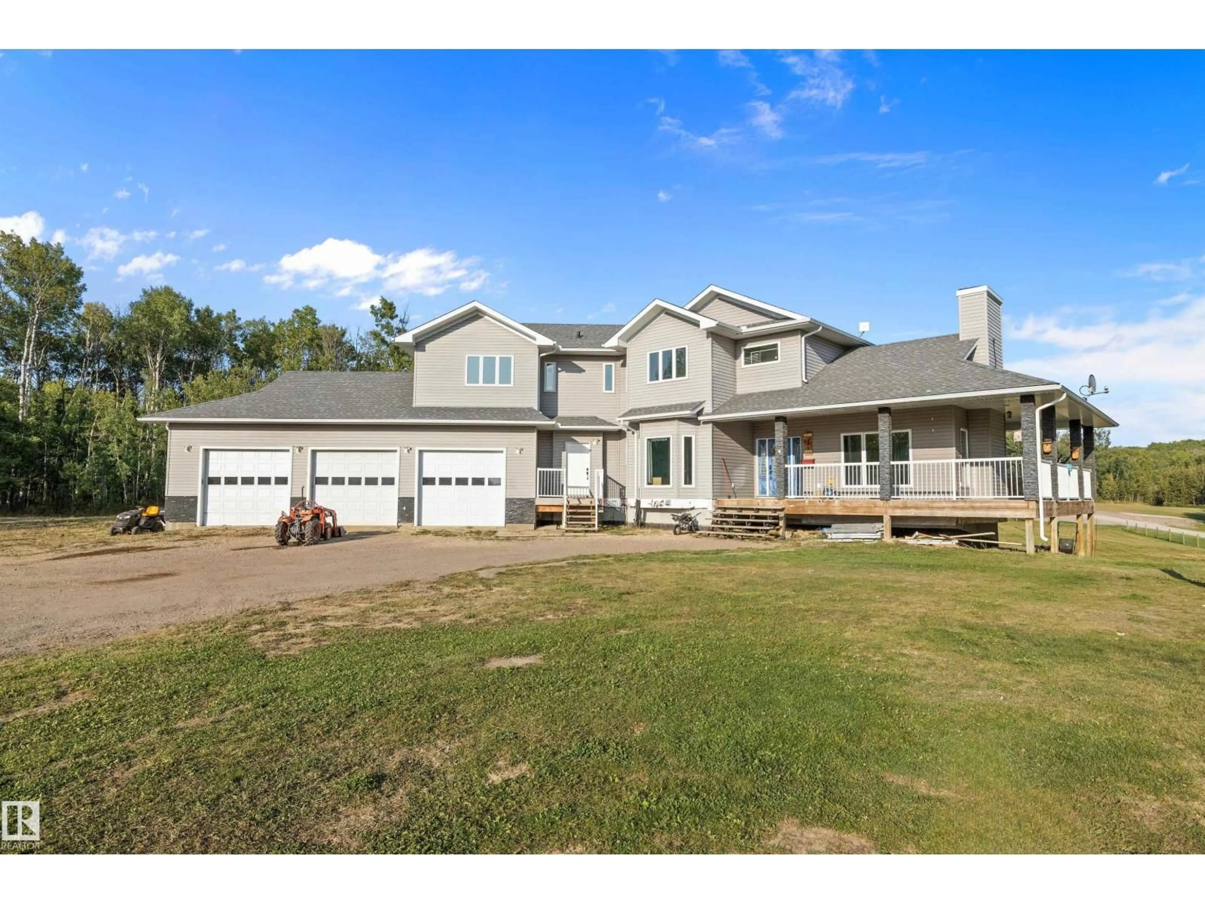 A pic from outside/outdoor area/front of a property/back of a property/a pic from drone, water/lake/river/ocean view for 53215A RGE ROAD 13, Rural Parkland County Alberta T7Y0C1