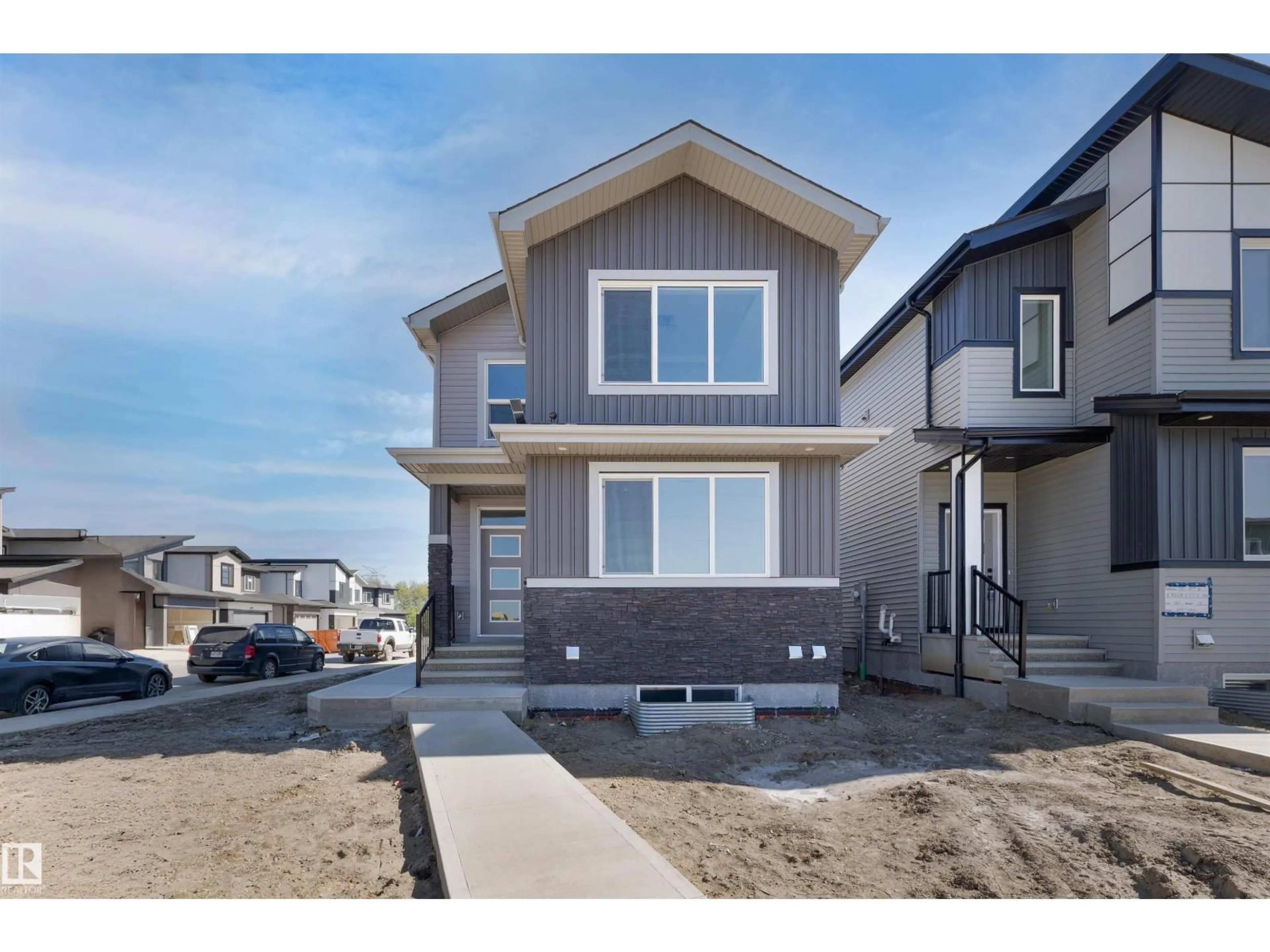 Home with vinyl exterior material, street for SW - 111 25 ST, Edmonton Alberta T6X3K3