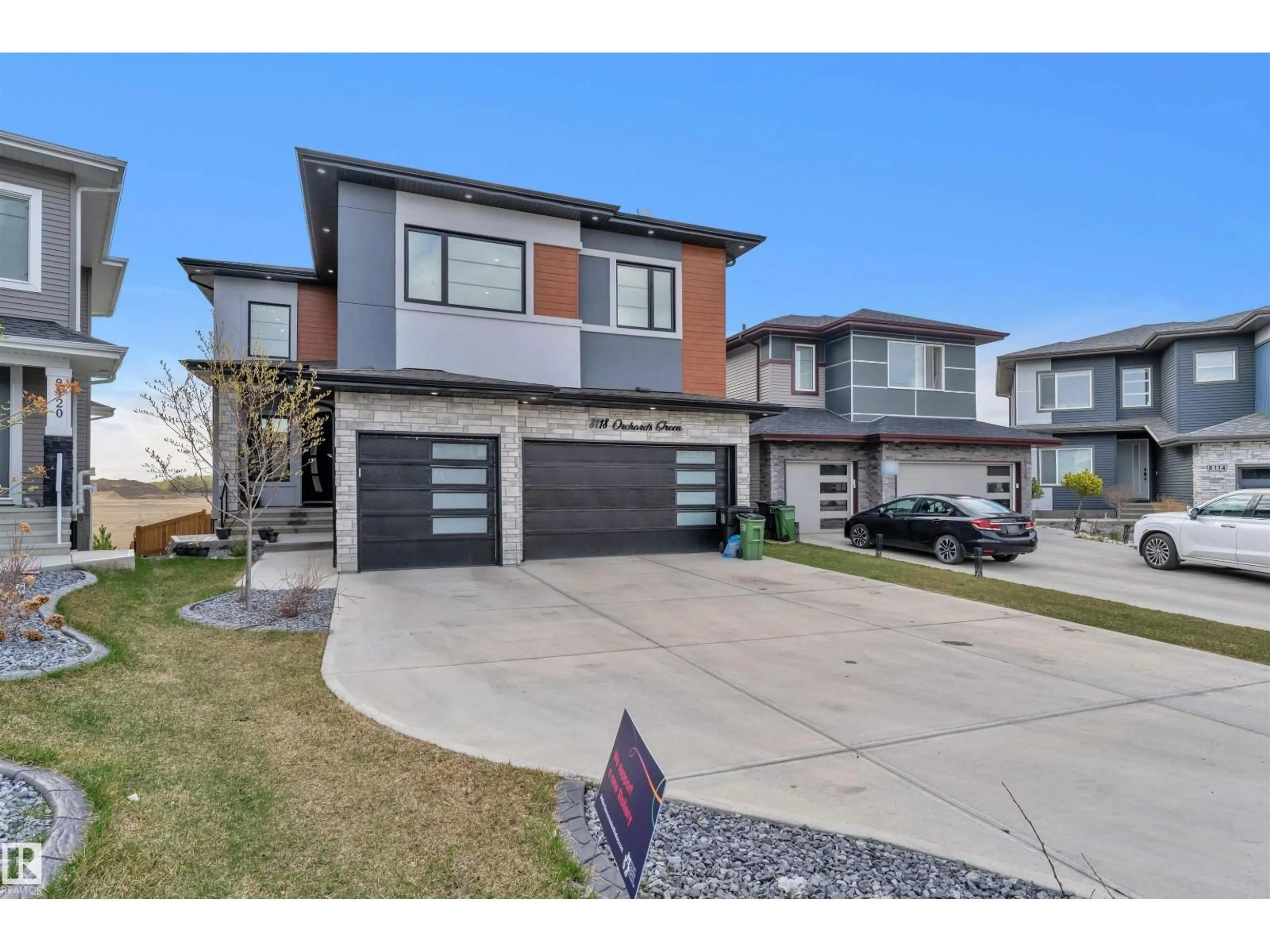 Home with brick exterior material, street for SW - 8118 ORCHARDS GREEN GR, Edmonton Alberta T6X2N5
