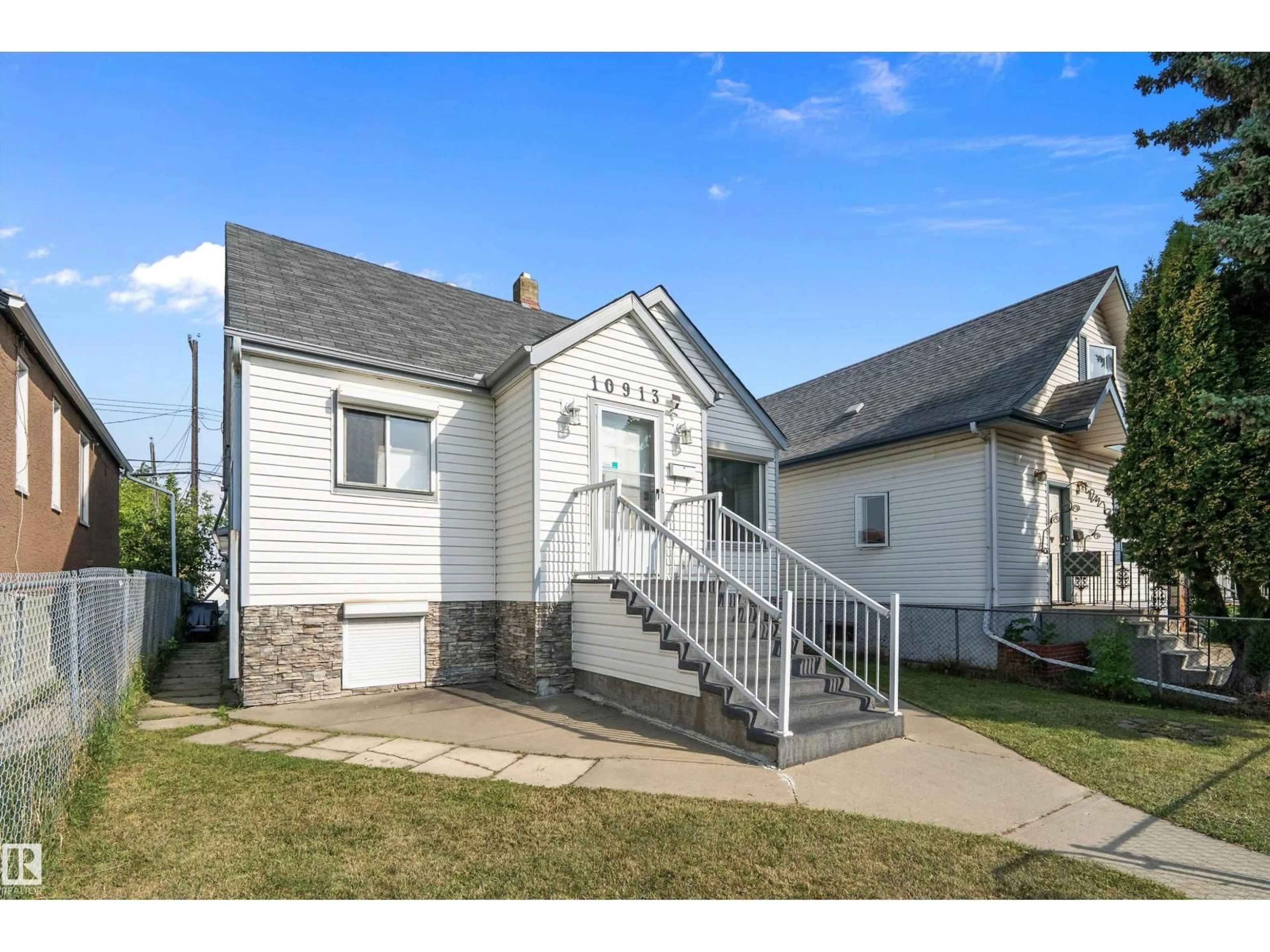 Home with vinyl exterior material, street for NW - 10913 97 ST, Edmonton Alberta T5H2M7