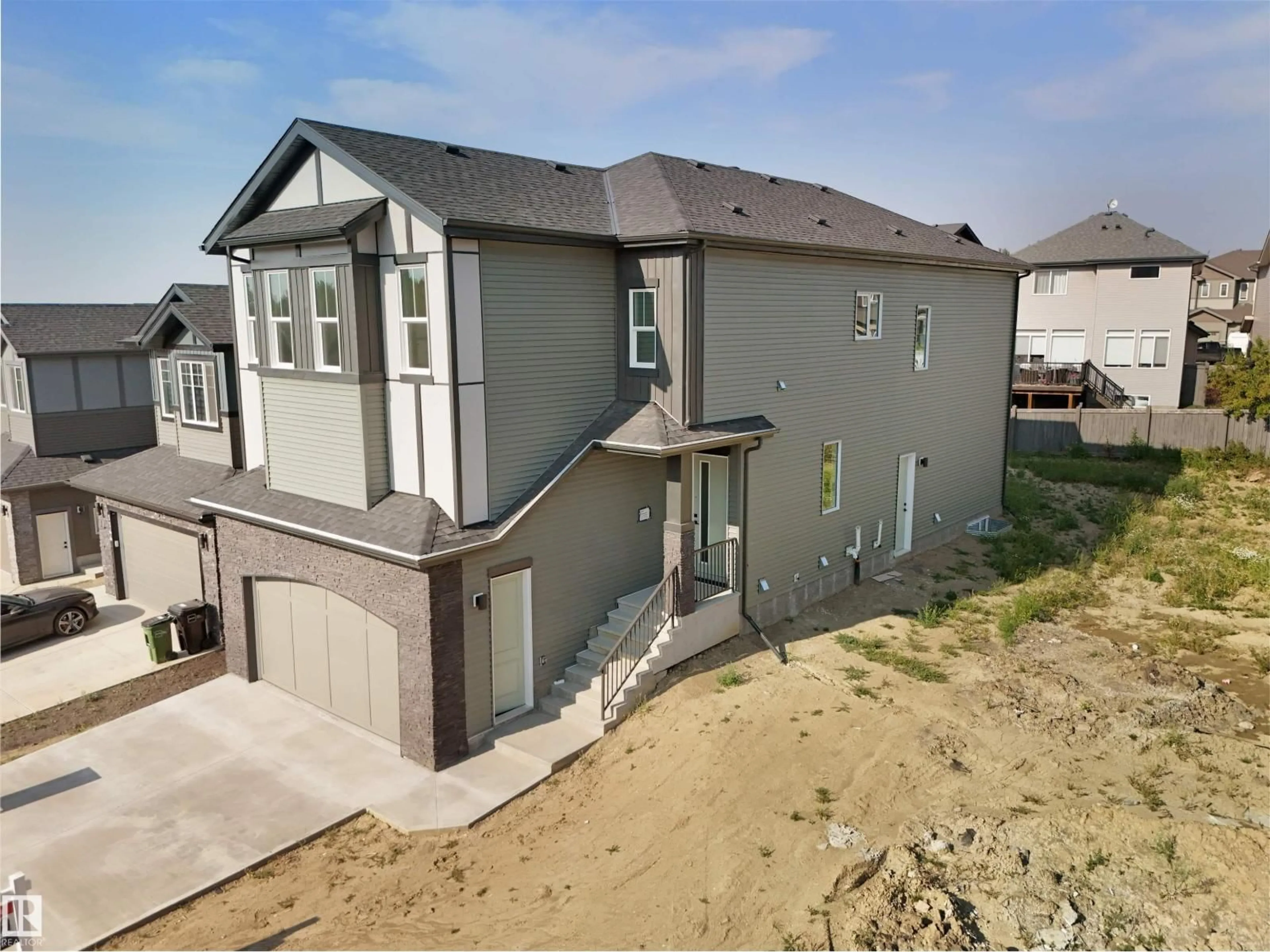 A pic from outside/outdoor area/front of a property/back of a property/a pic from drone, street for 1142 GYRFALCON CR, Edmonton Alberta T5S0S5