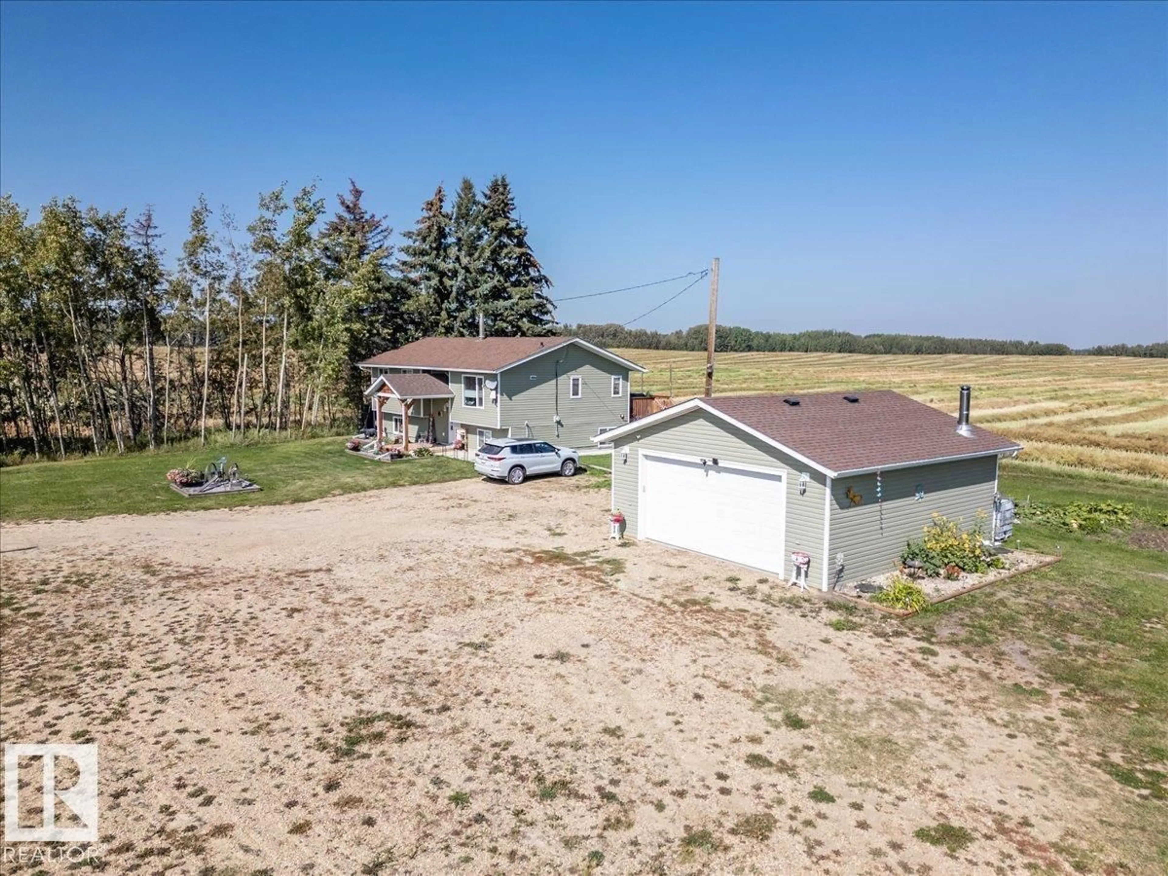 A pic from outside/outdoor area/front of a property/back of a property/a pic from drone, unknown for 275006 HWY 616, Rural Wetaskiwin County Alberta T0C2C0