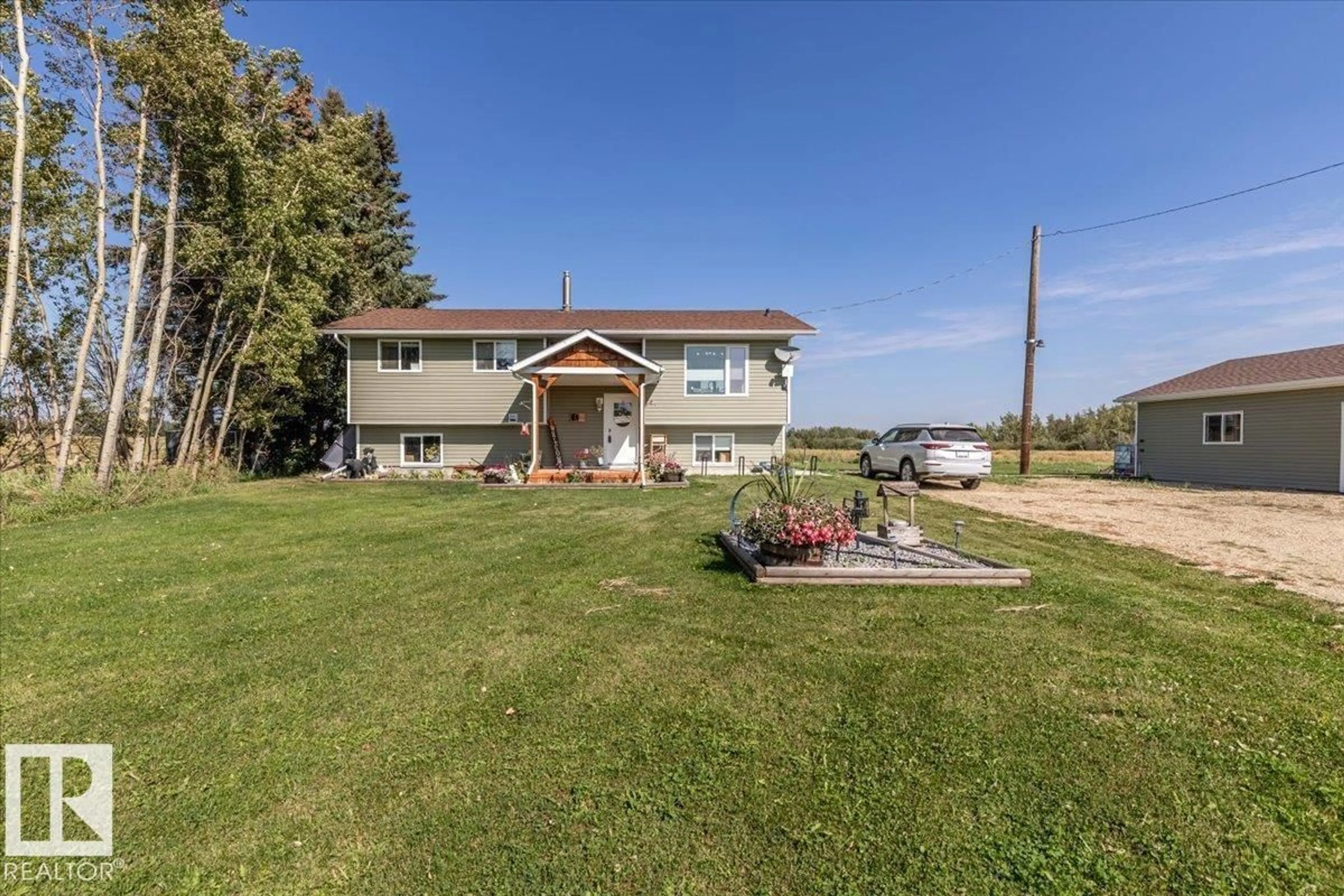 A pic from outside/outdoor area/front of a property/back of a property/a pic from drone, water/lake/river/ocean view for 275006 HWY 616, Rural Wetaskiwin County Alberta T0C2C0