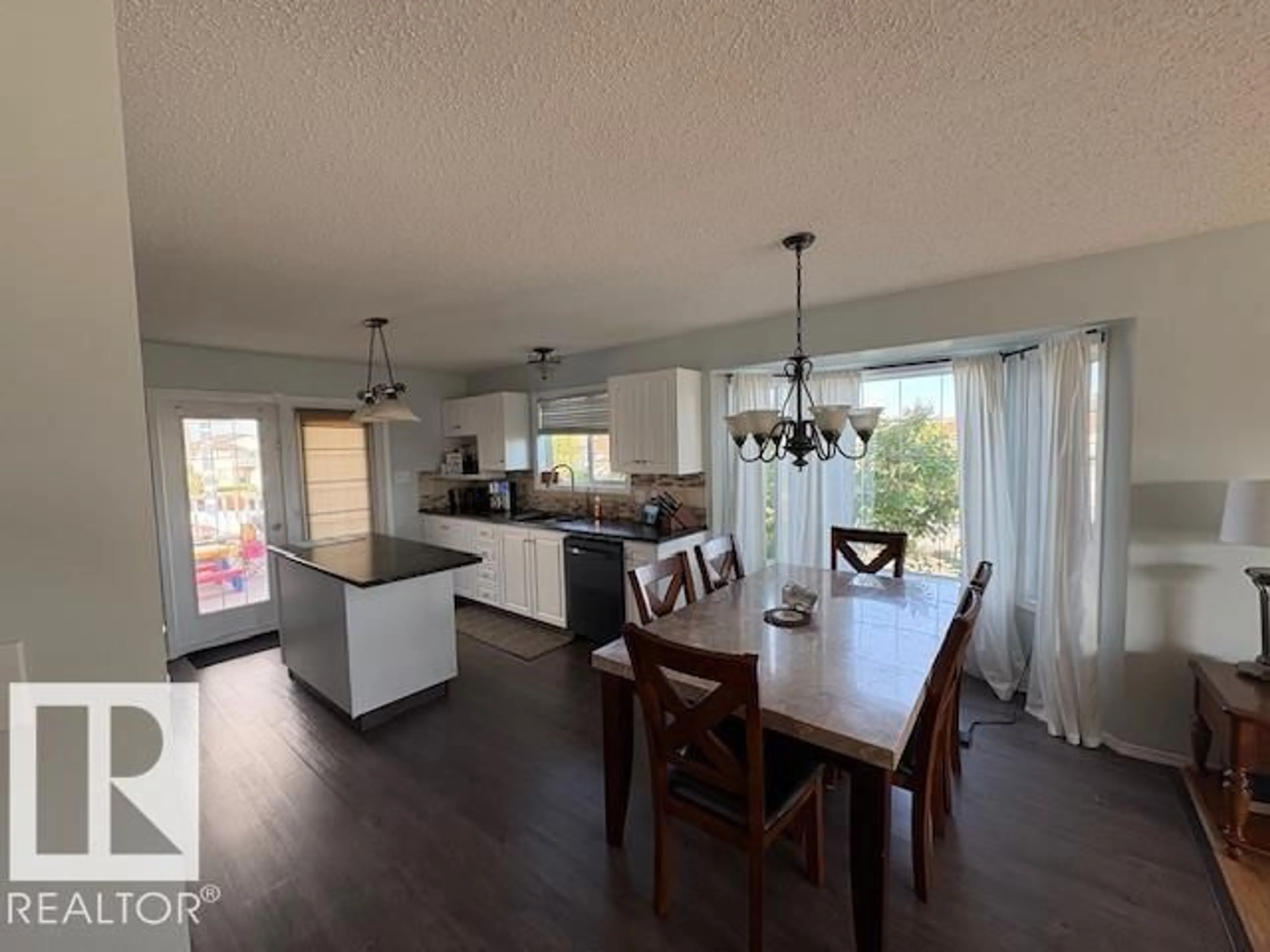 Open concept kitchen, wood/laminate floor for 601 19 ST, Cold Lake Alberta T9M1C6
