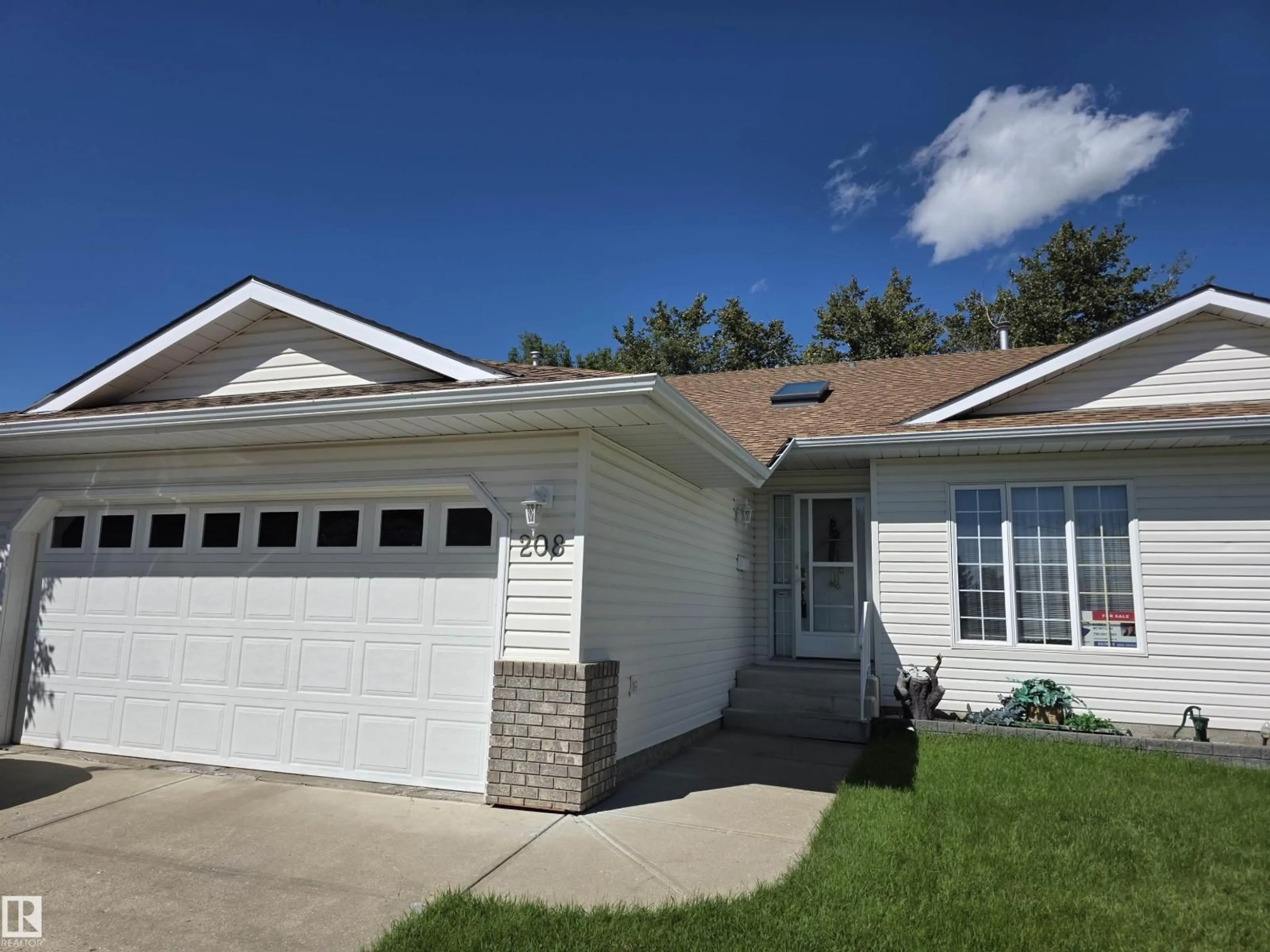 Home with vinyl exterior material, street for 208 RAVINE VI, Leduc Alberta T9E8B9