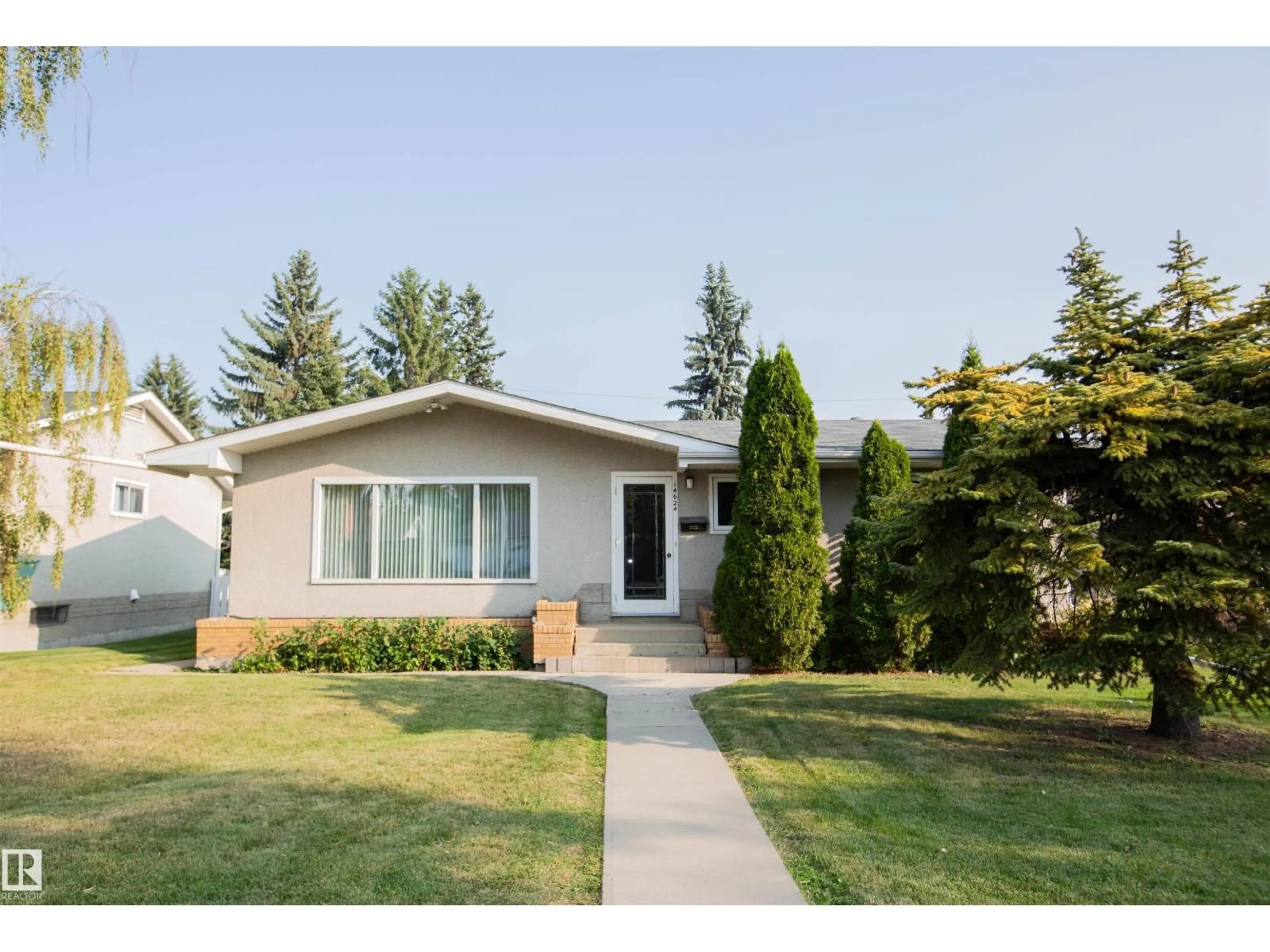 Home with vinyl exterior material, street for 14624 87 AV, Edmonton Alberta T5R4E4