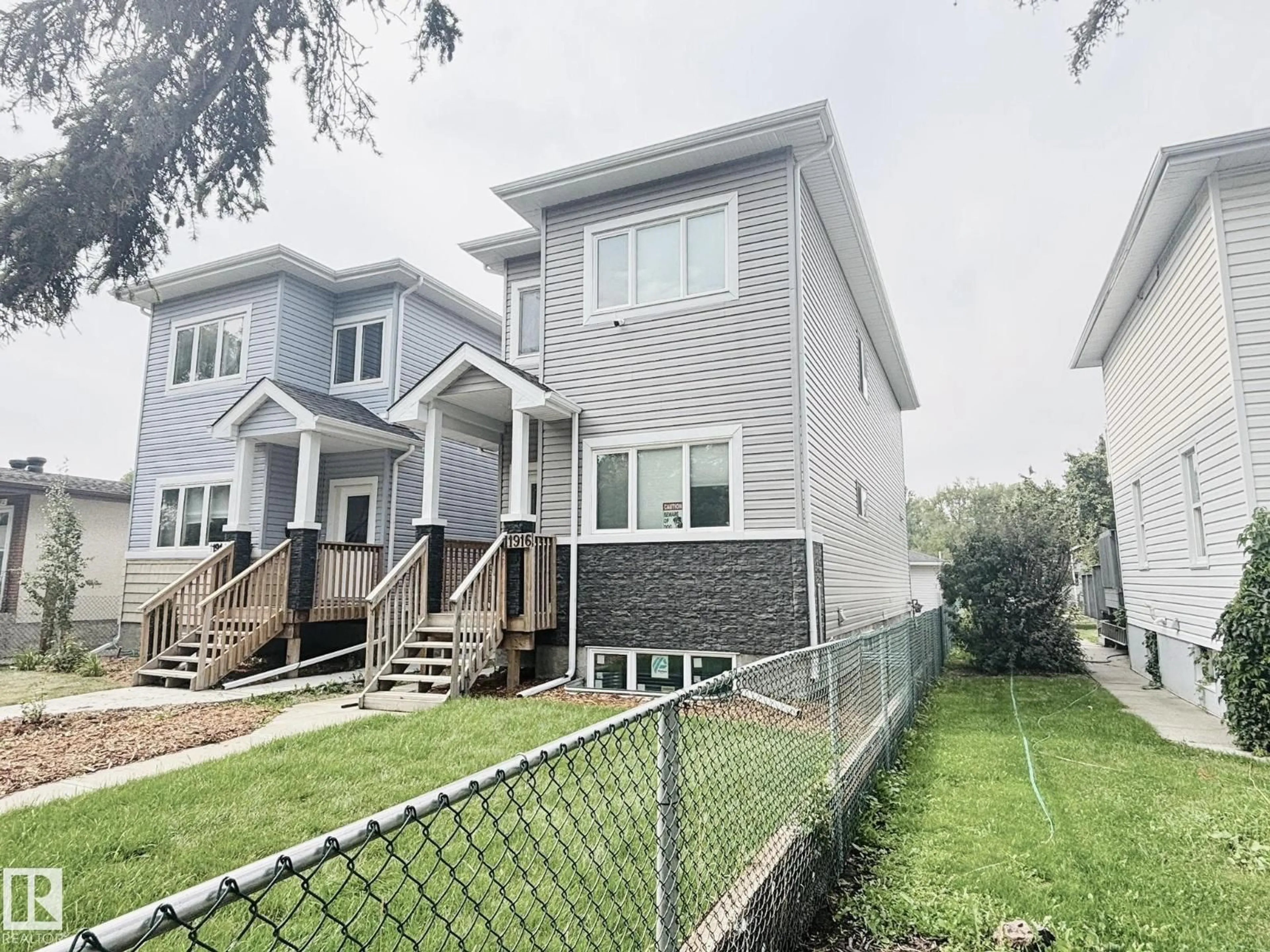 Home with vinyl exterior material, street for 11916 89 ST, Edmonton Alberta T5B3V8