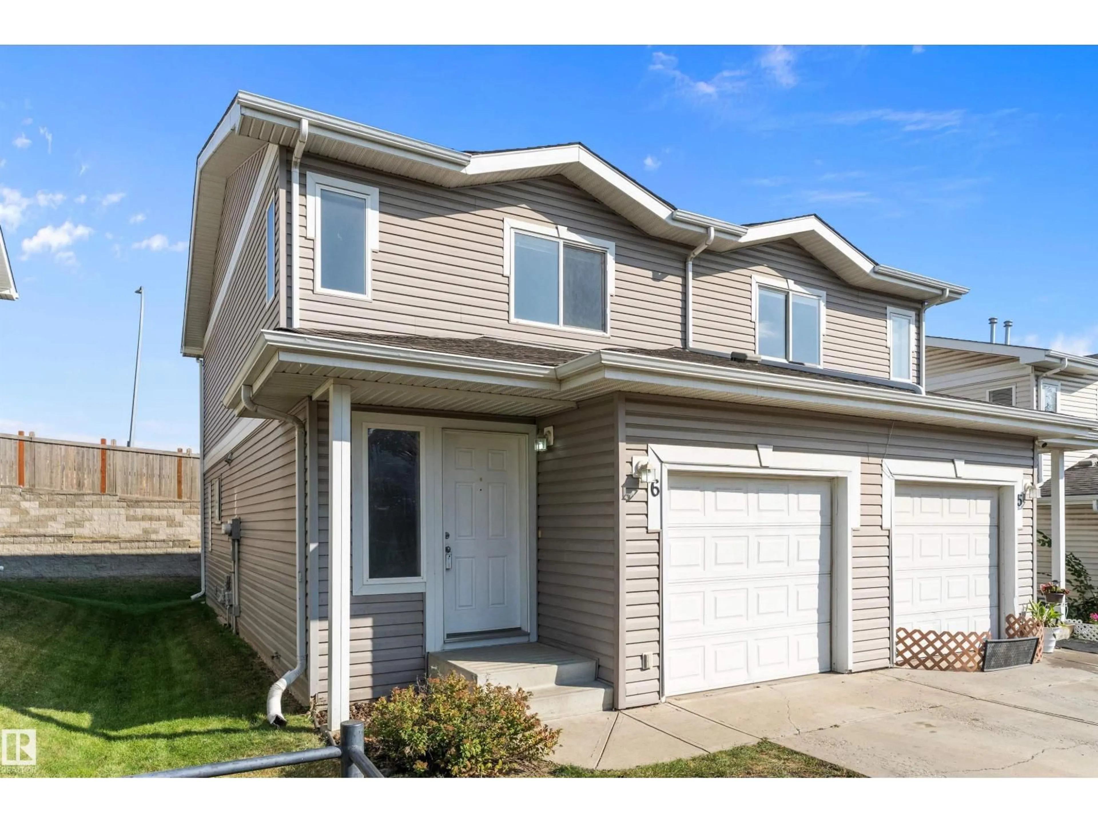 Home with vinyl exterior material, street for #6 - 130 HYNDMAN CR, Edmonton Alberta T5A0E8