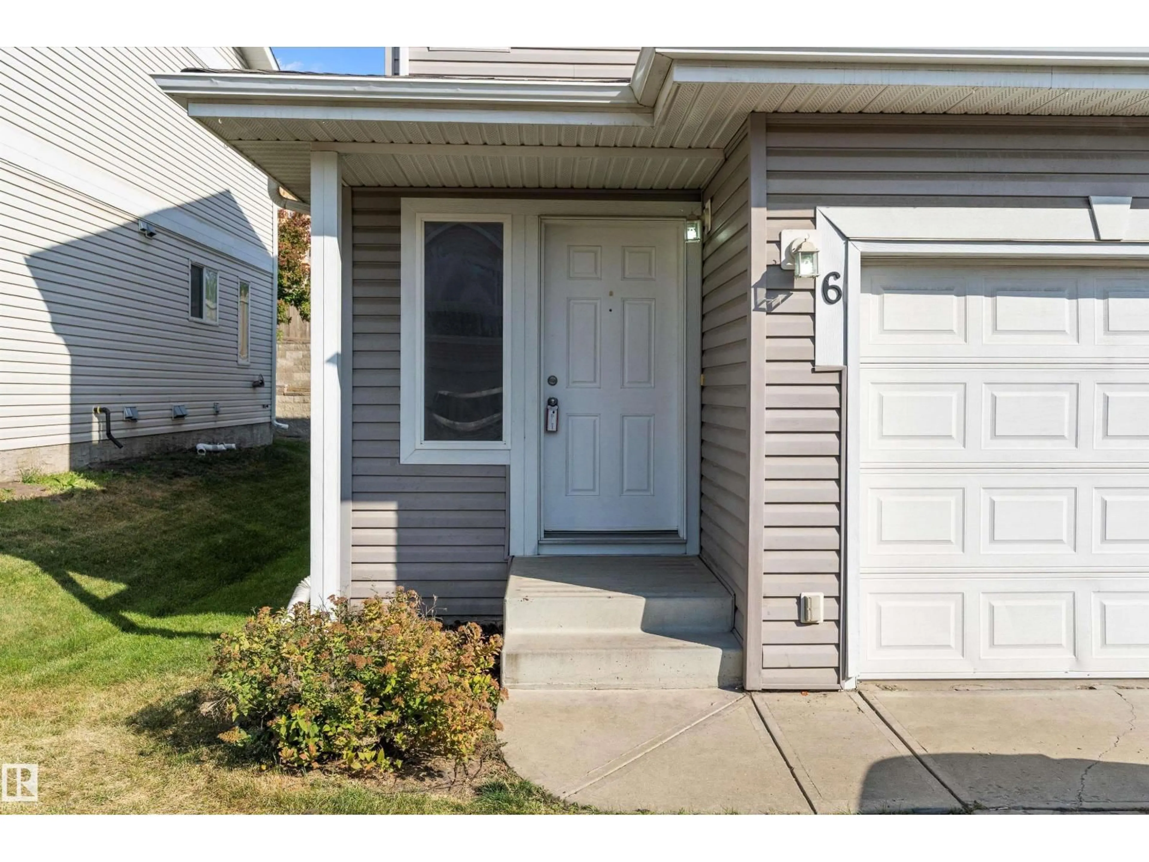 Home with vinyl exterior material, street for #6 - 130 HYNDMAN CR, Edmonton Alberta T5A0E8