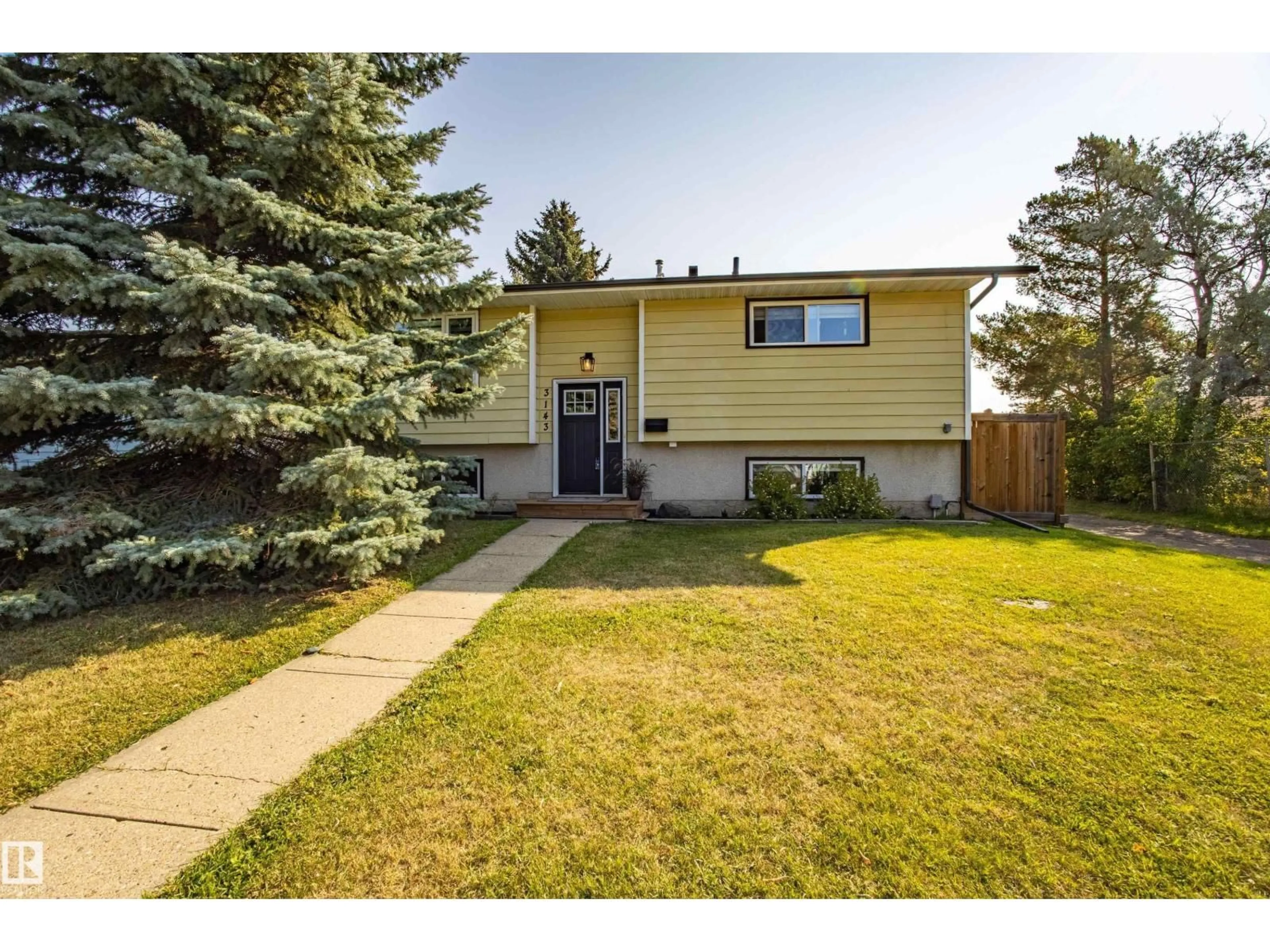 Home with vinyl exterior material, street for 3143 73 ST, Edmonton Alberta T6K1K2