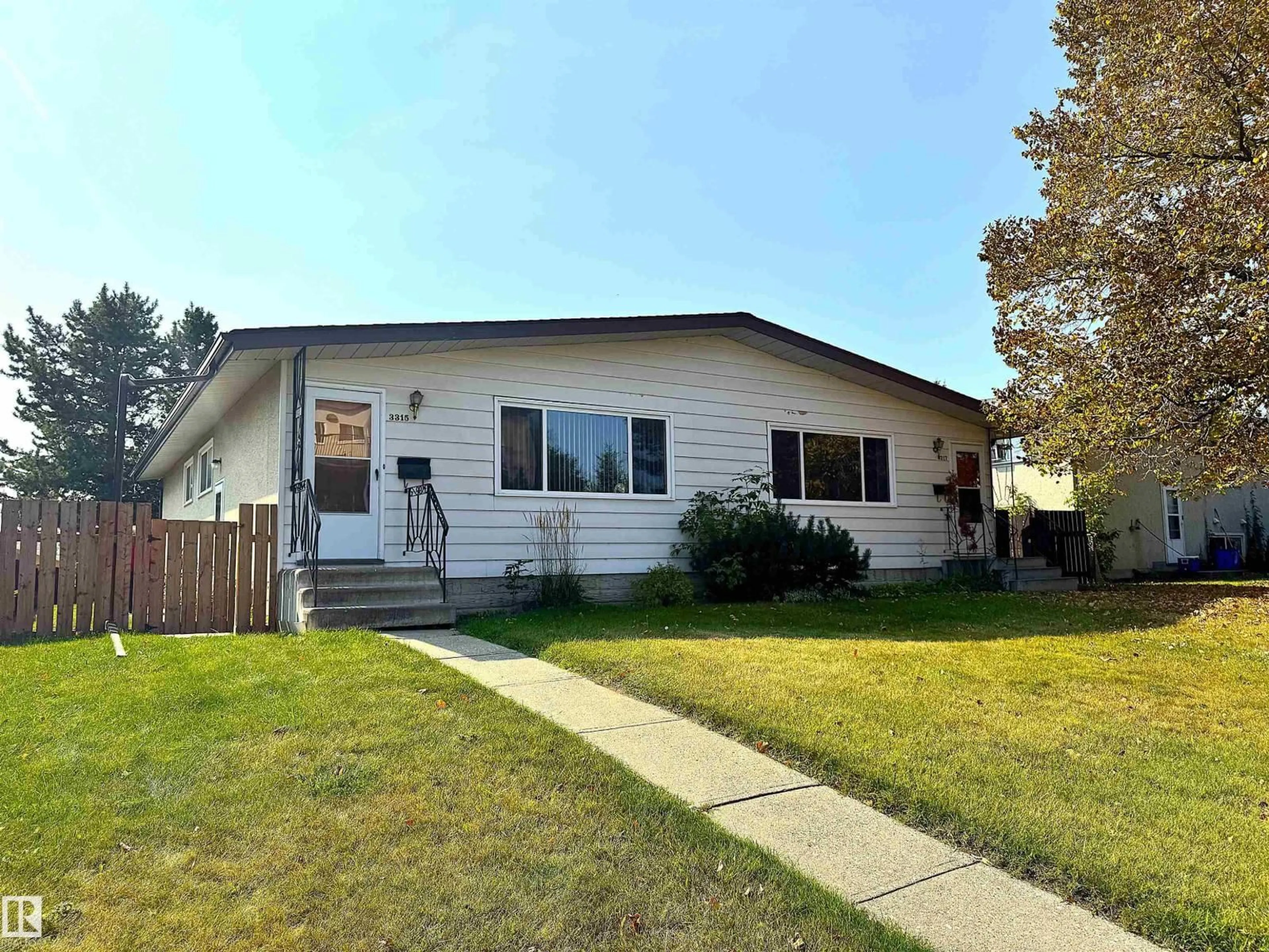 Home with vinyl exterior material, street for 3315 & 3317 105 AV, Edmonton Alberta T5W0B5