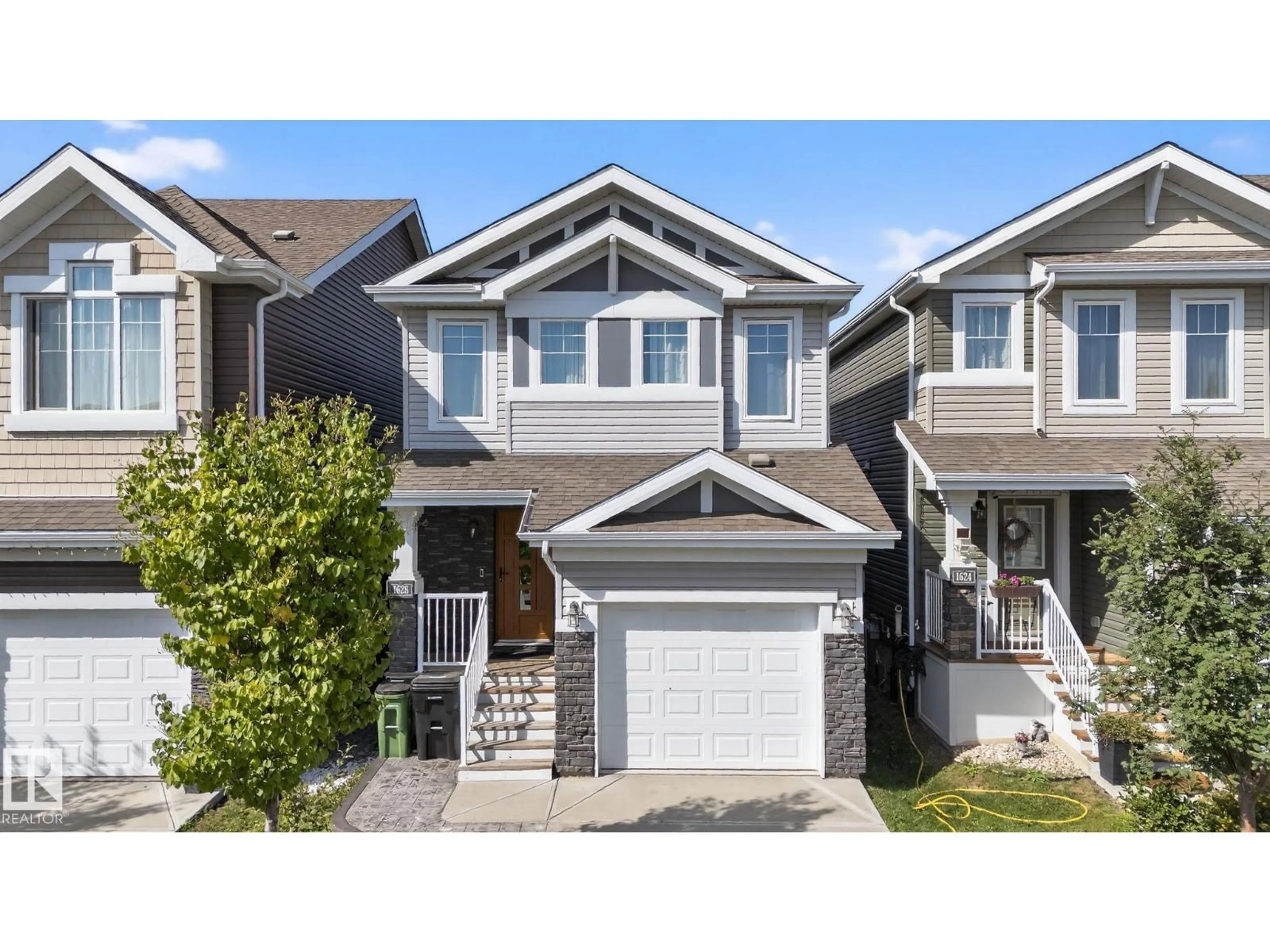 Home with vinyl exterior material, street for SW - 1628 167 ST, Edmonton Alberta T6W3C4