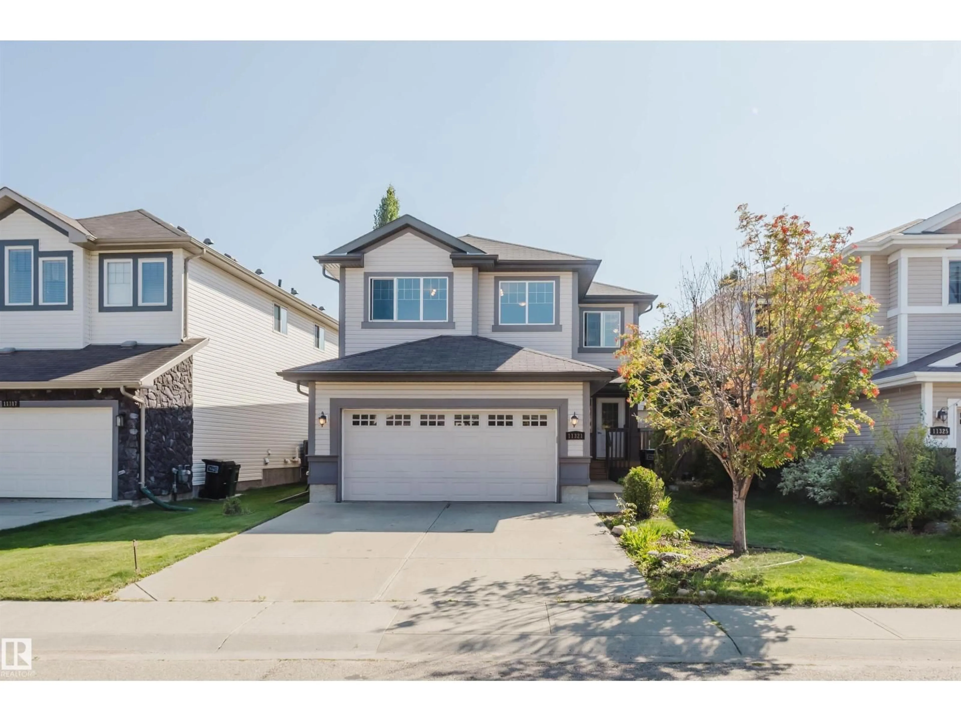 Home with vinyl exterior material, street for 11321 13A AV, Edmonton Alberta T6W0G9