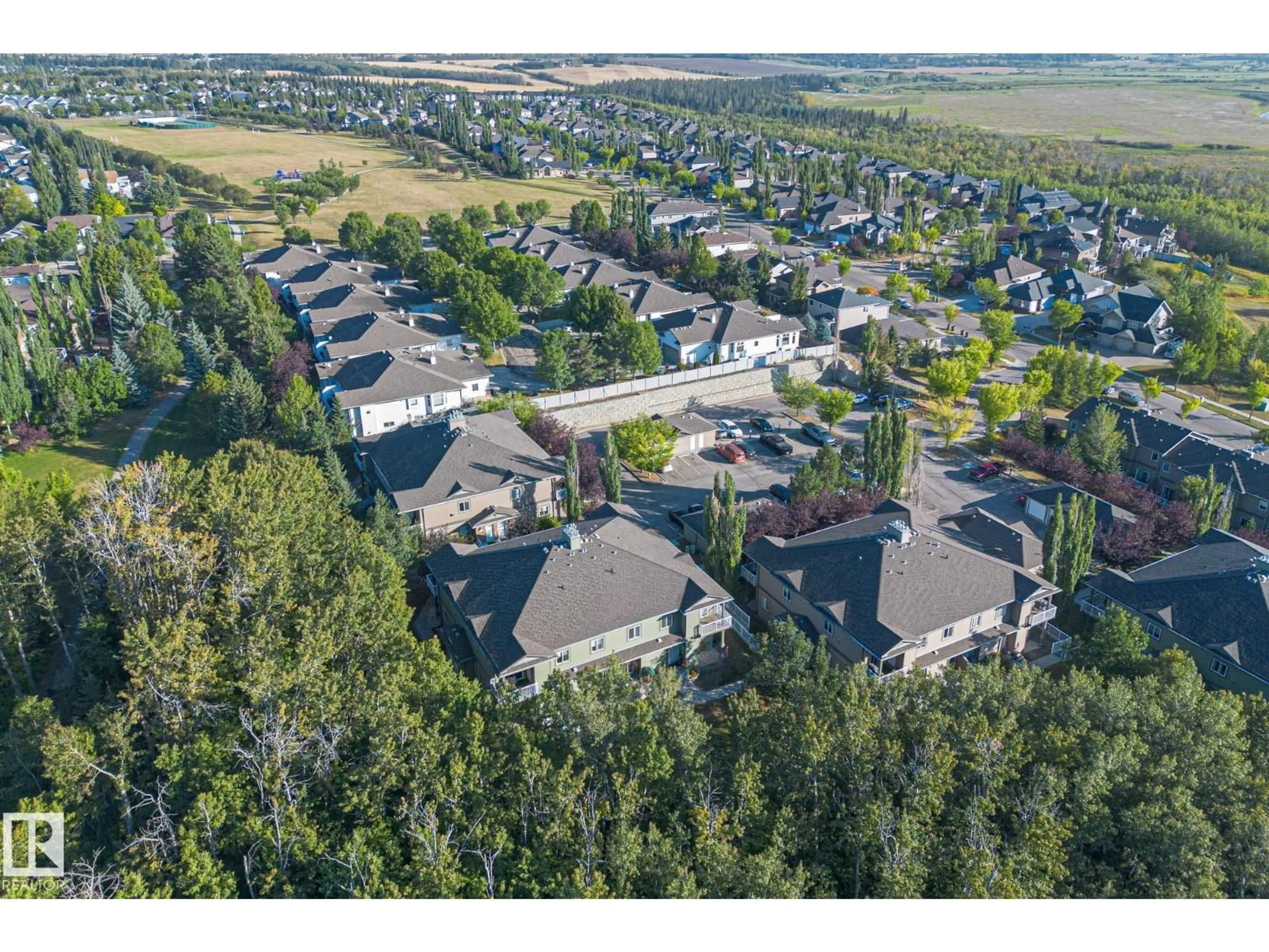 A pic from outside/outdoor area/front of a property/back of a property/a pic from drone, mountain view for 30 - 34 OAK VISTA DR, St. Albert Alberta T8N3T1
