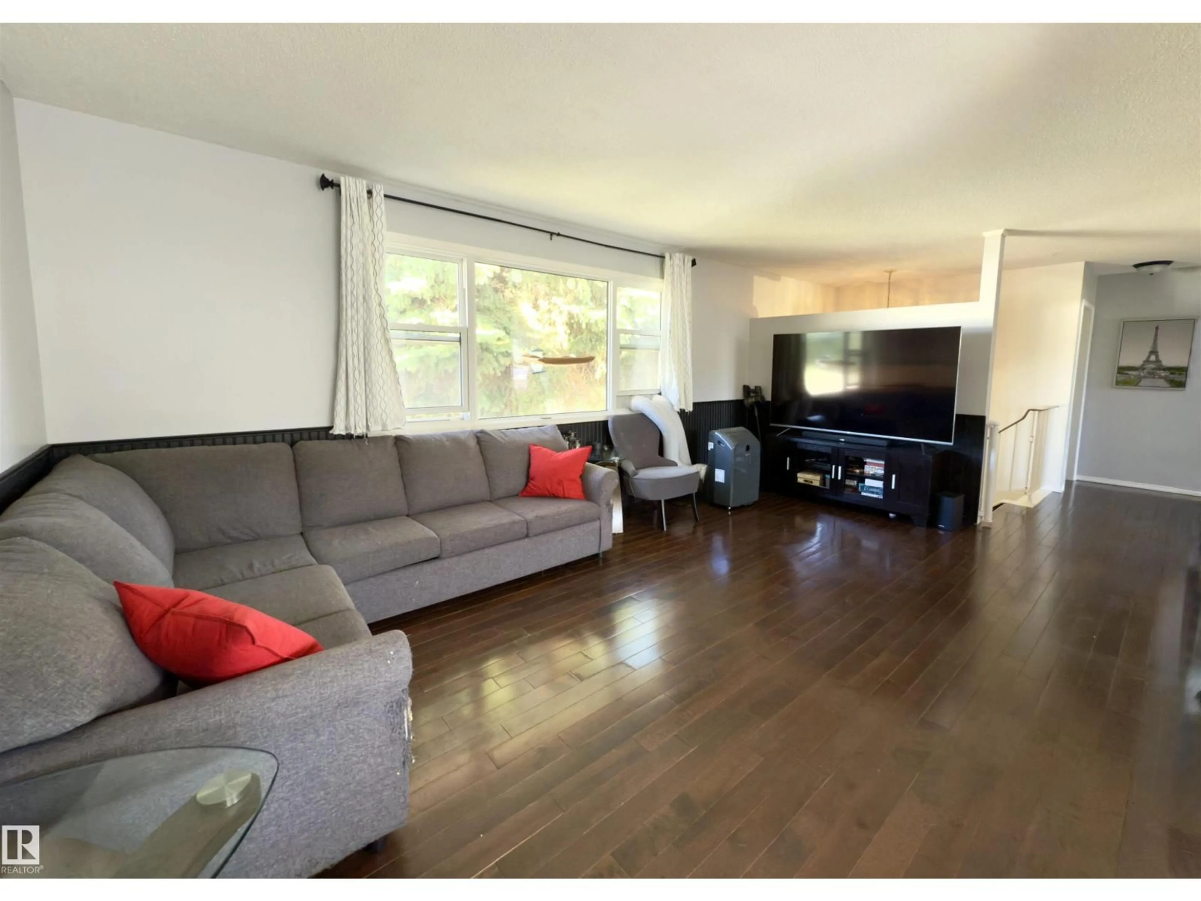 Living room with furniture, wood/laminate floor for 4911 48 AV, Bon Accord Alberta T0A0K0