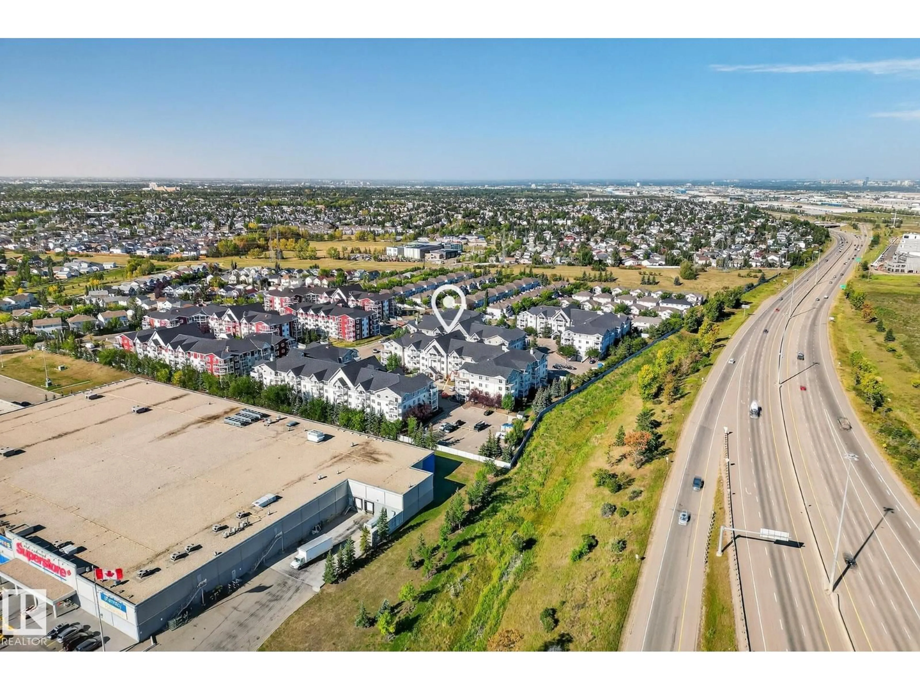 A pic from outside/outdoor area/front of a property/back of a property/a pic from drone, street for #215 - 2208 44 AV NW, Edmonton Alberta T6T0G6