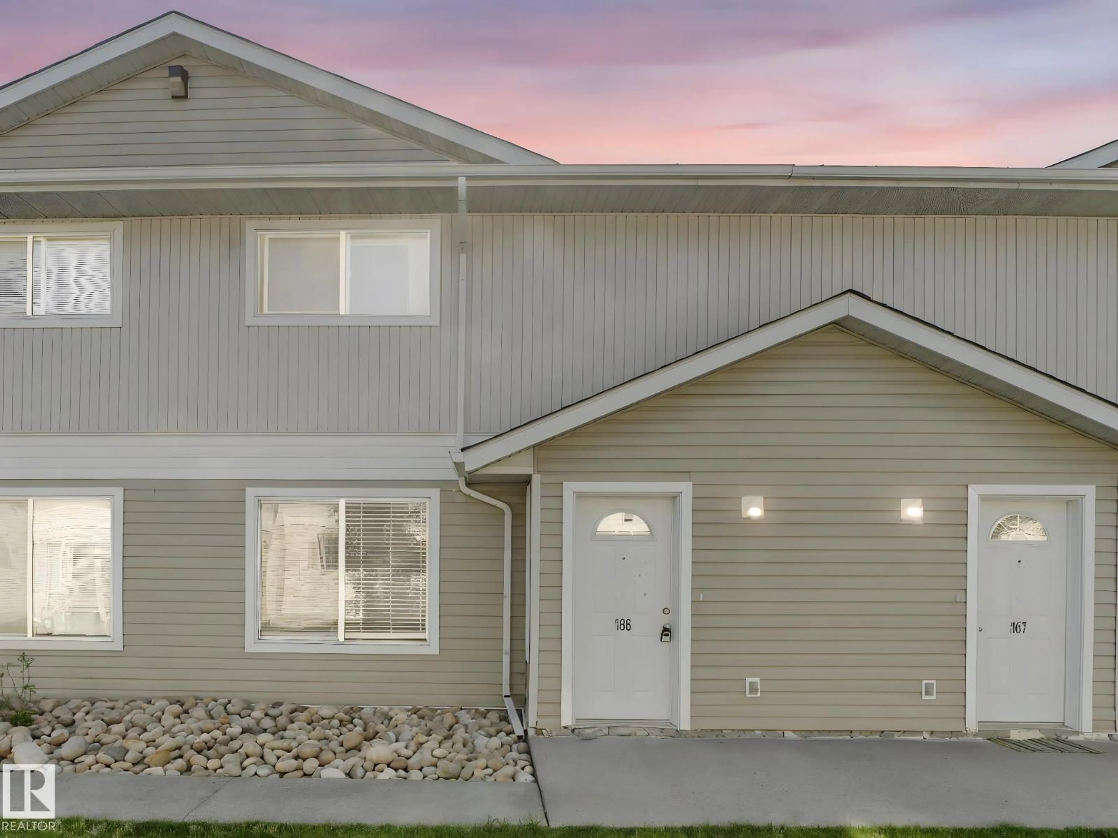 Home with vinyl exterior material, street for 166 180 BRIDGEPORT BV, Leduc Alberta T9E8S1