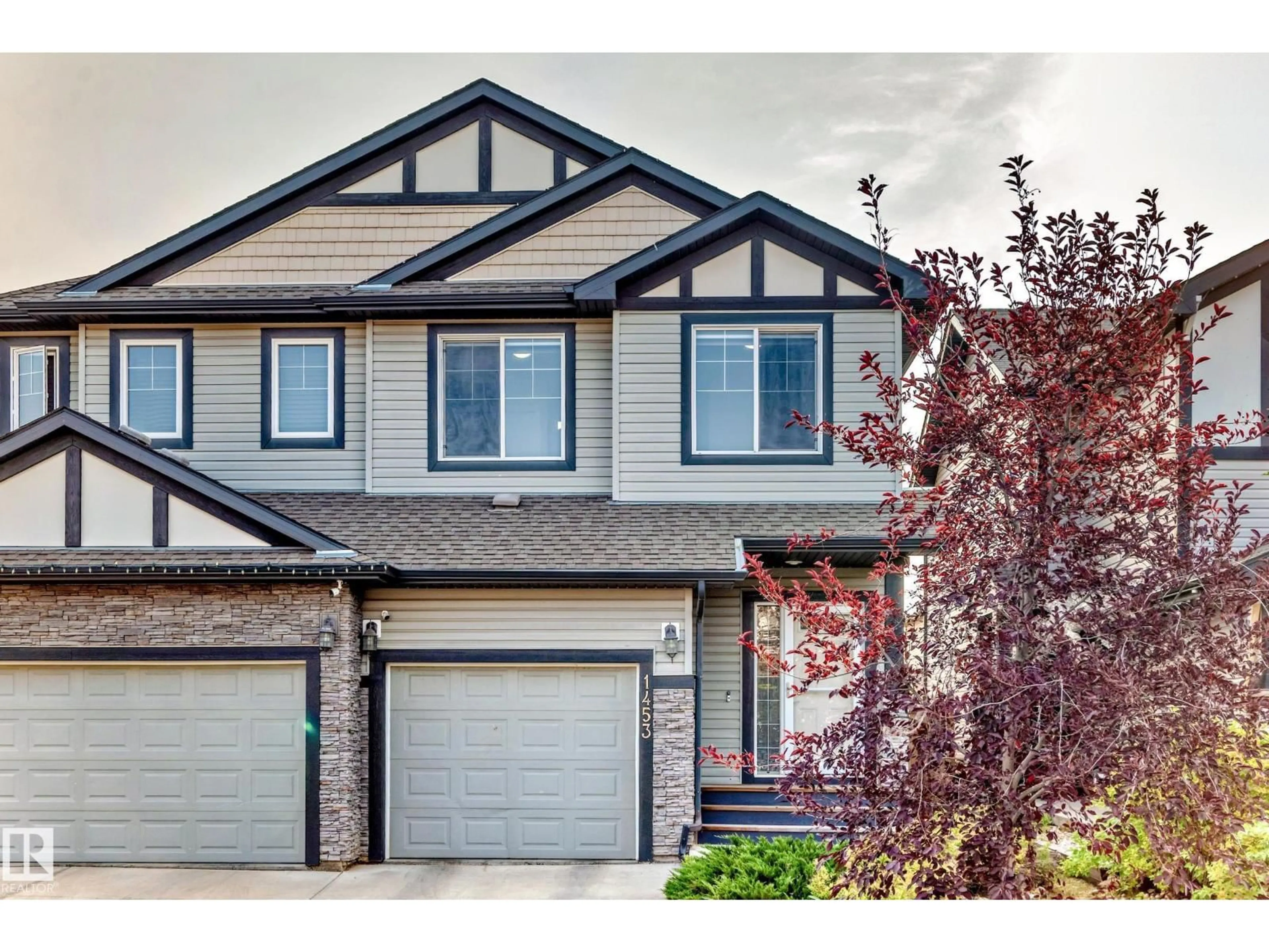 Home with vinyl exterior material, street for 1453 33A ST, Edmonton Alberta T5T0V6