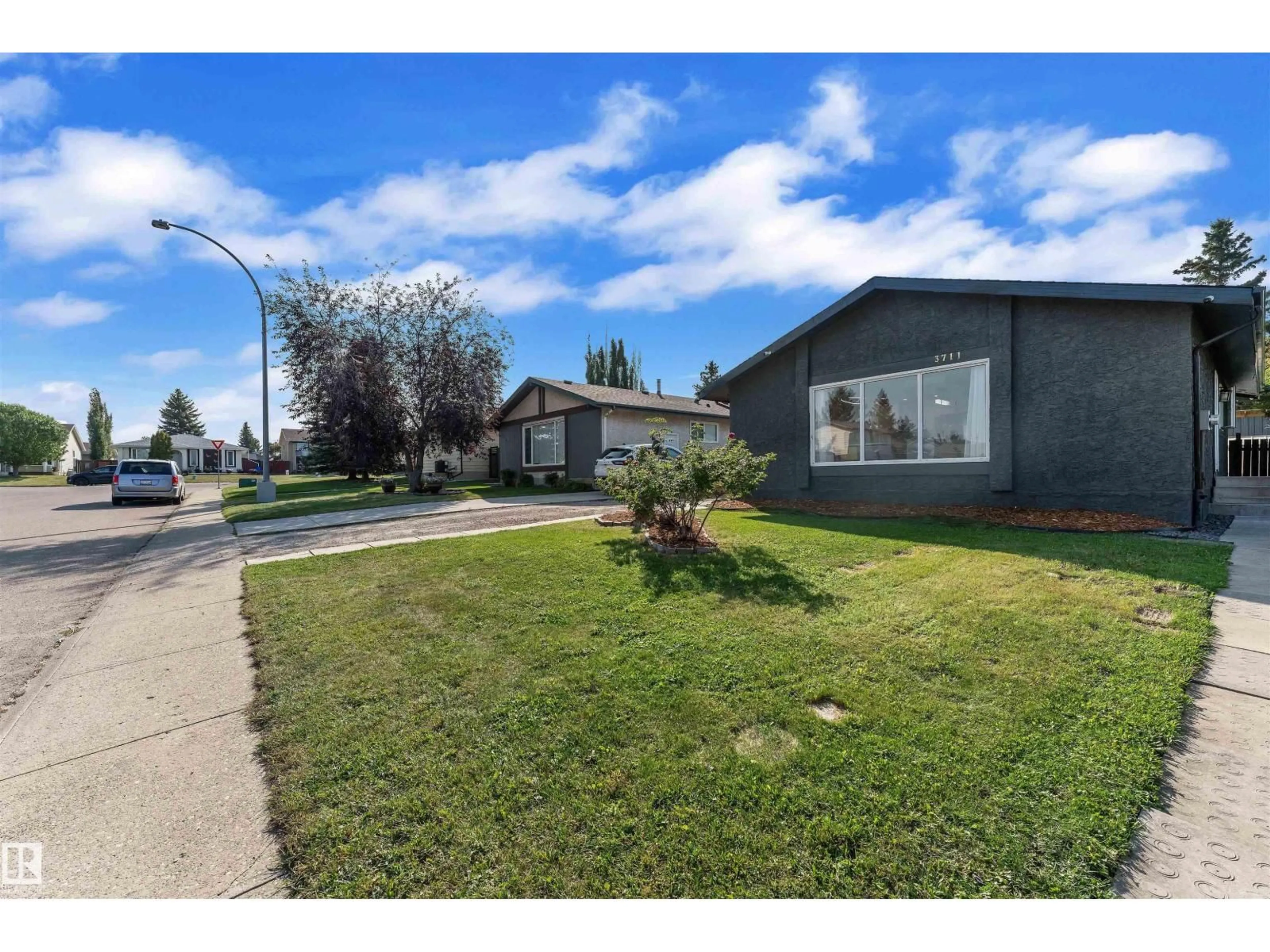A pic from outside/outdoor area/front of a property/back of a property/a pic from drone, street for 3711 17A AV, Edmonton Alberta T6L2R3